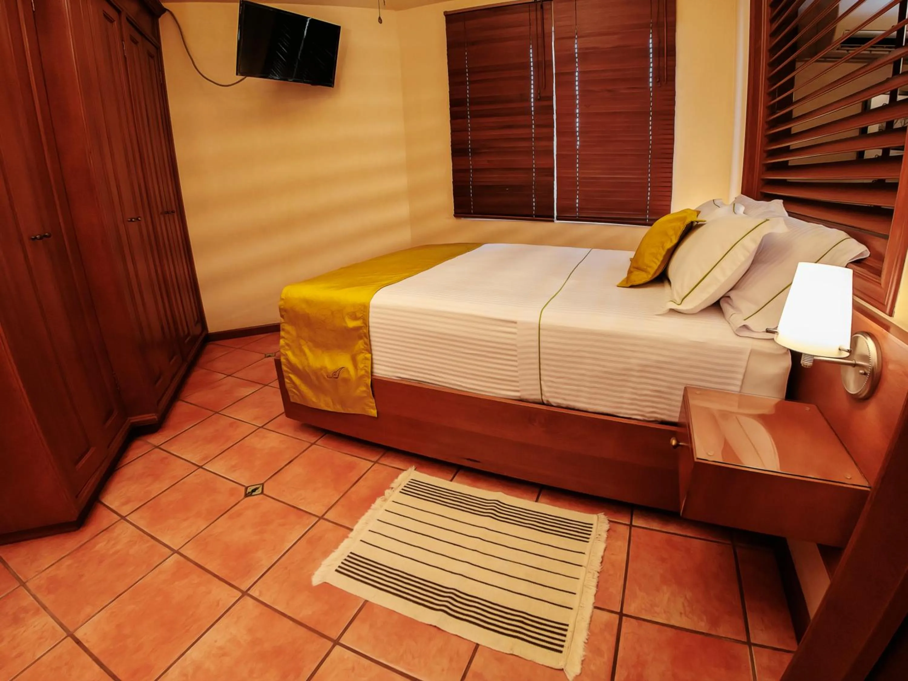 Bed in Alcazar Suites