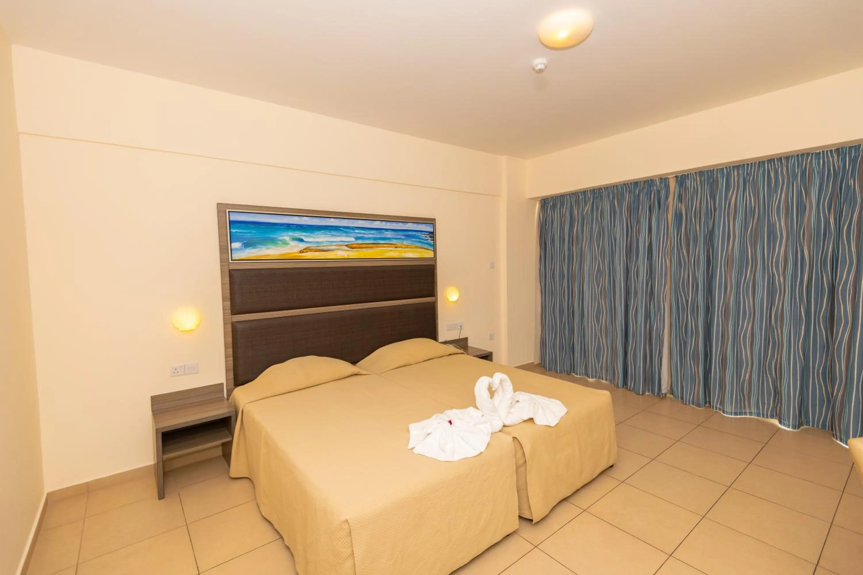 Bed in Tofinis Hotel