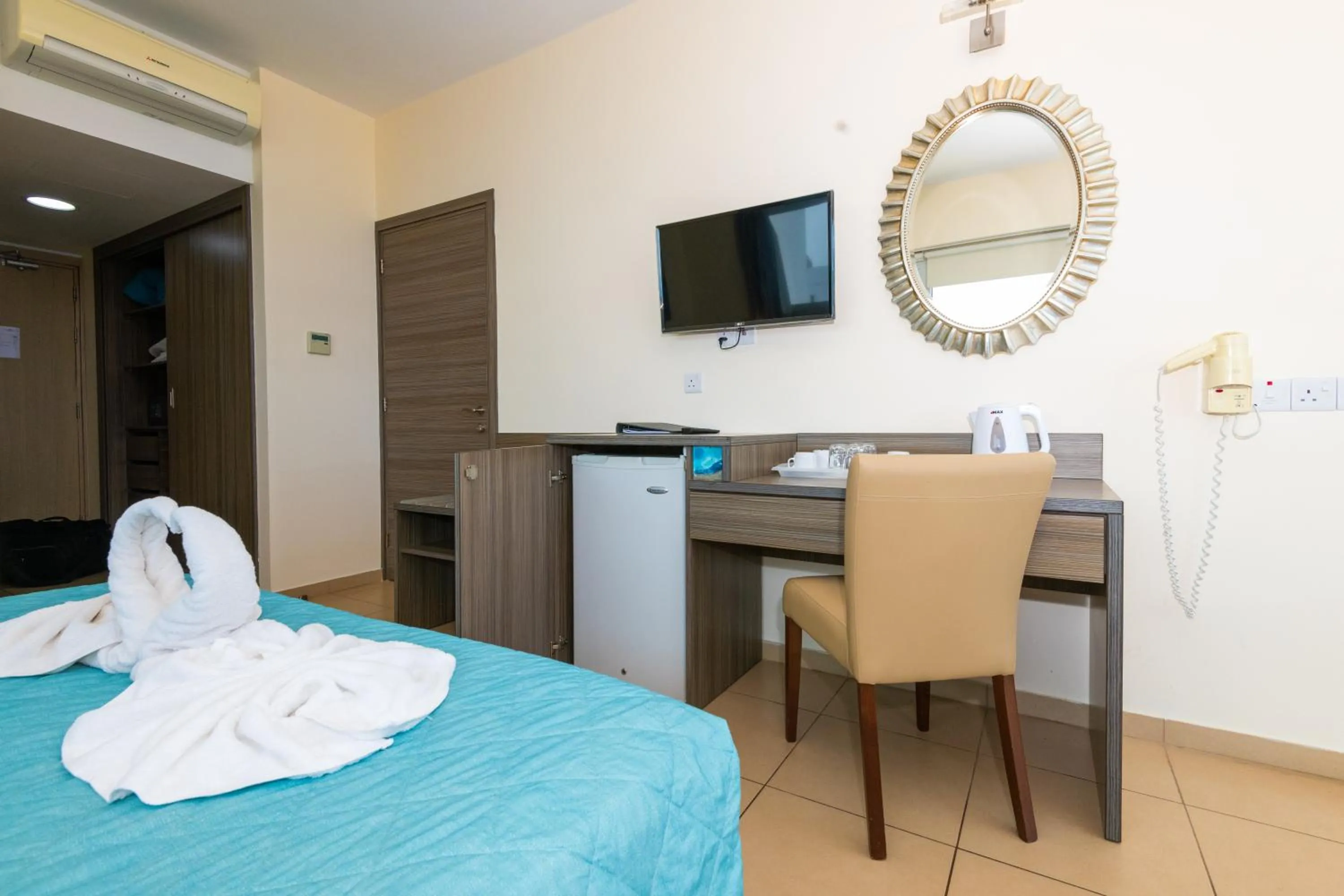 Bed in Tofinis Hotel