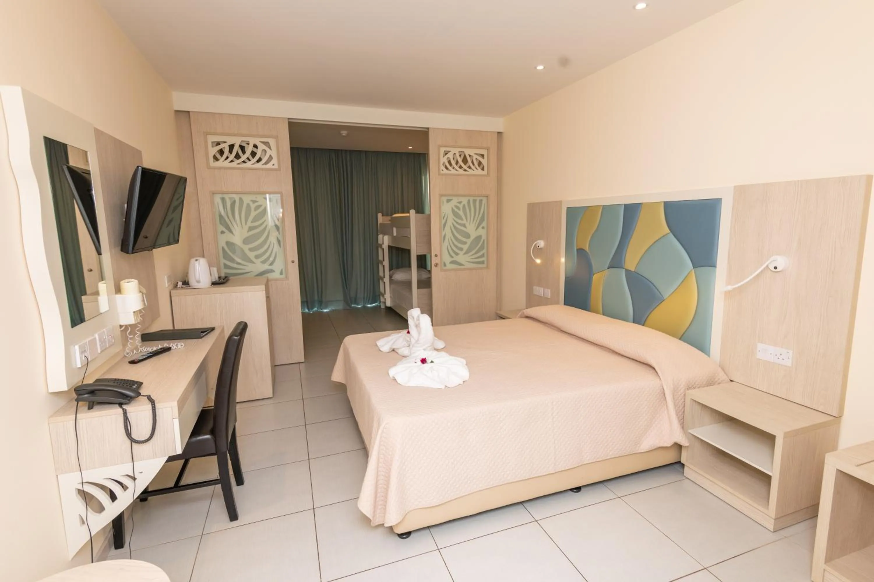 Bed in Tofinis Hotel