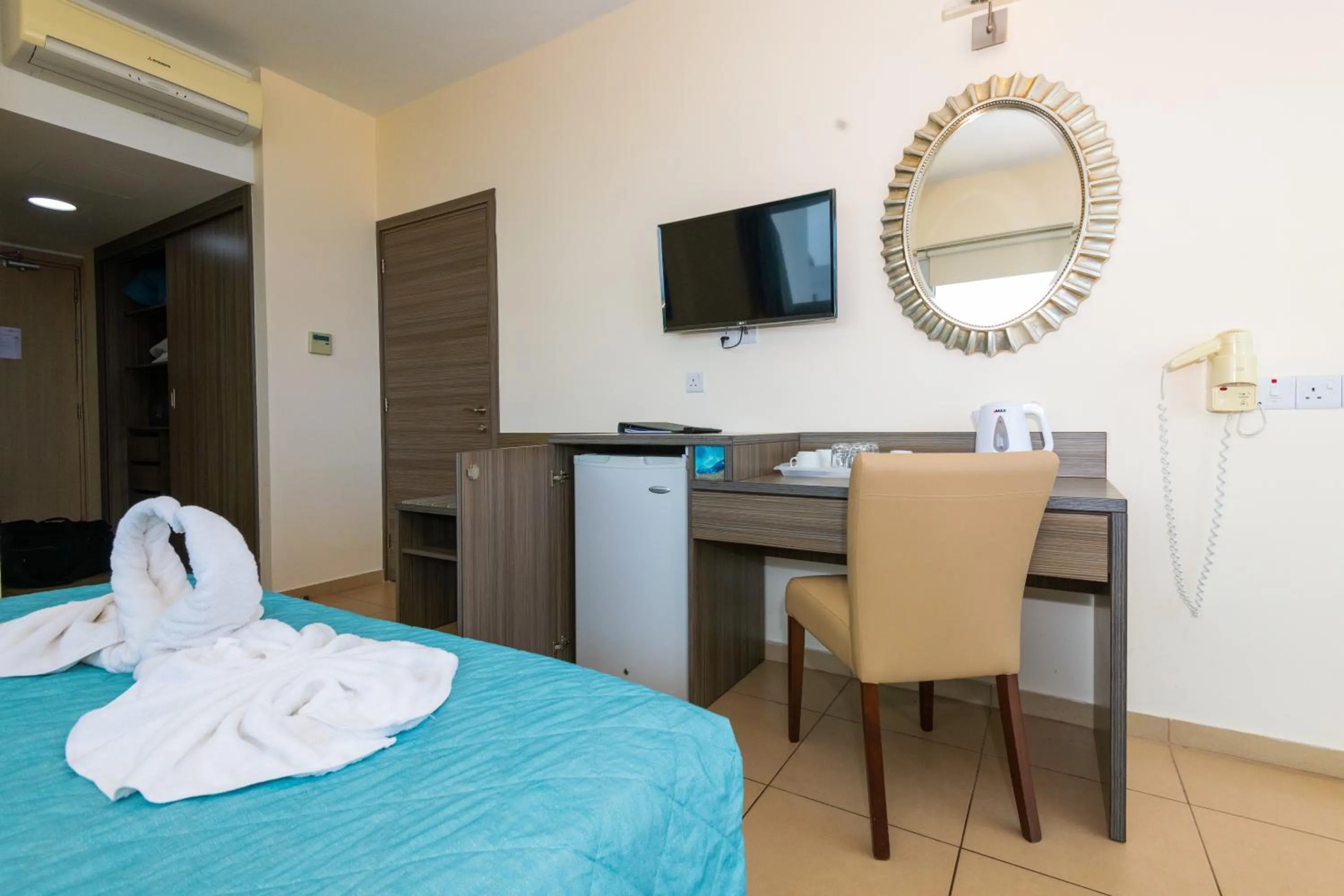 Bed in Tofinis Hotel