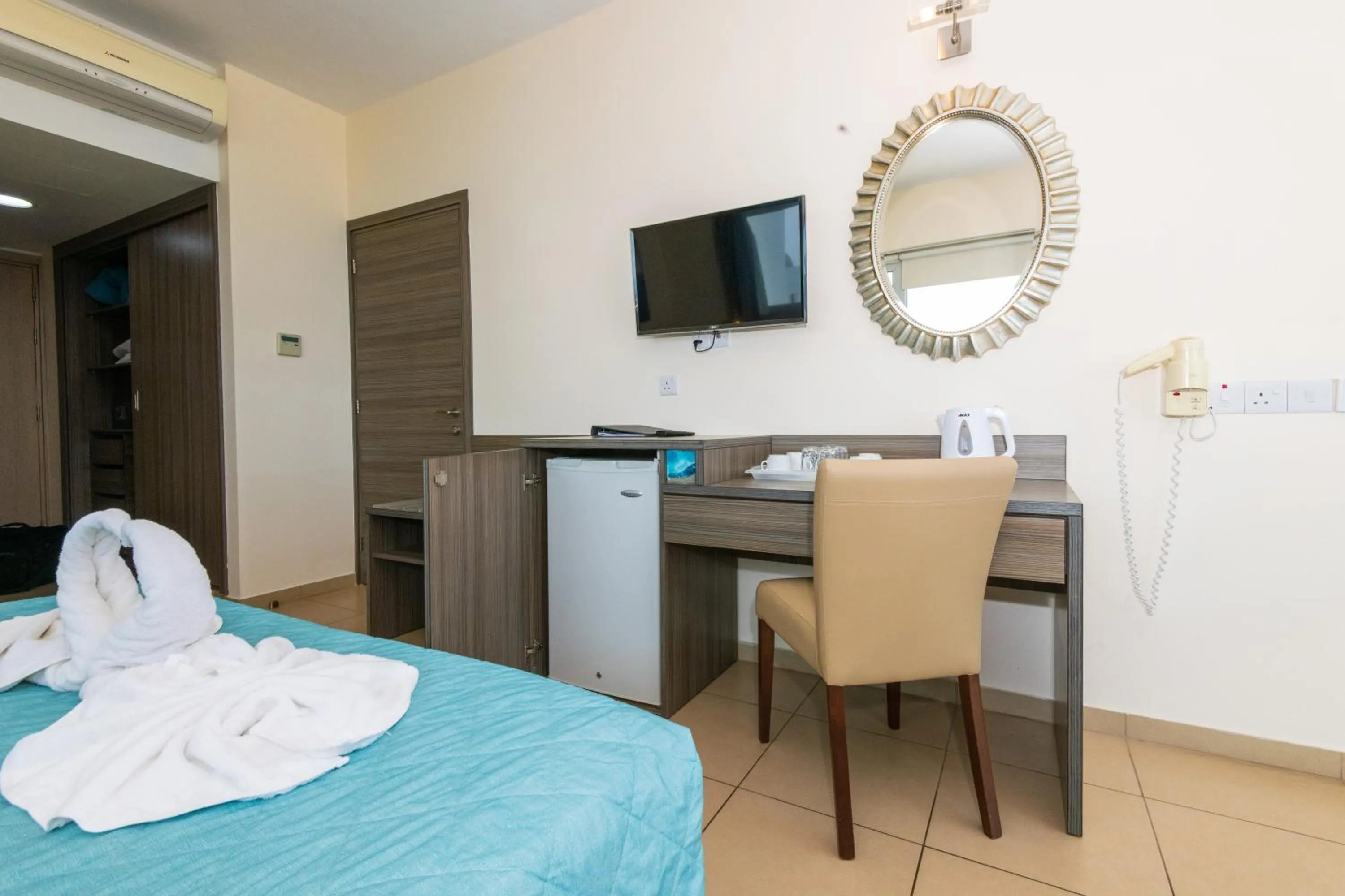 Bed in Tofinis Hotel