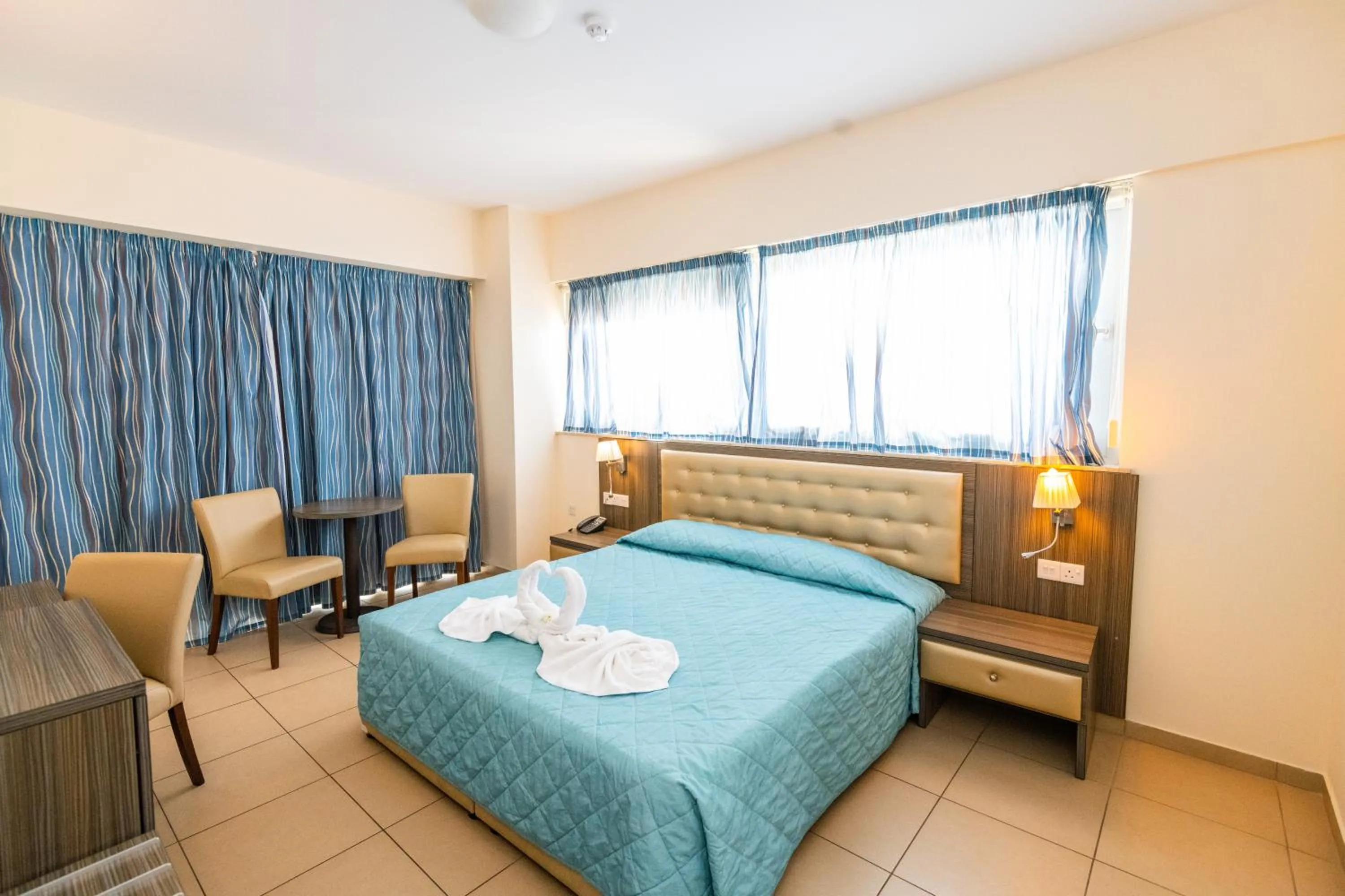 Bed in Tofinis Hotel