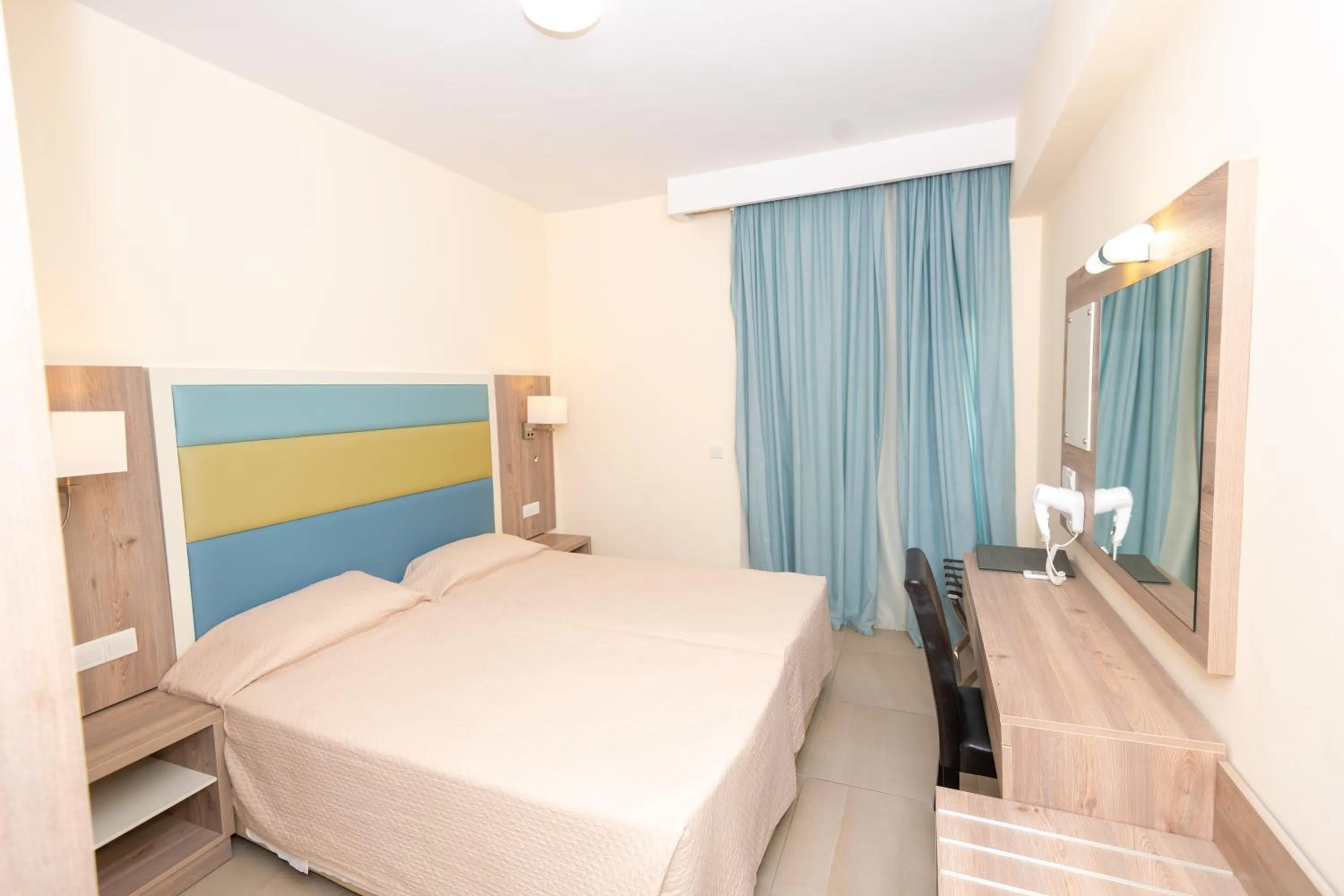 Bed in Tofinis Hotel