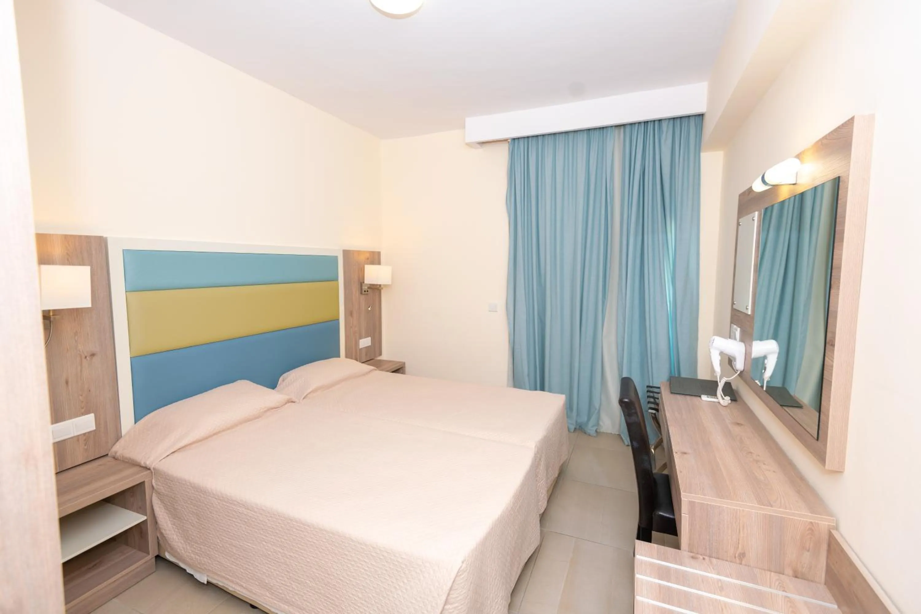 Bed in Tofinis Hotel