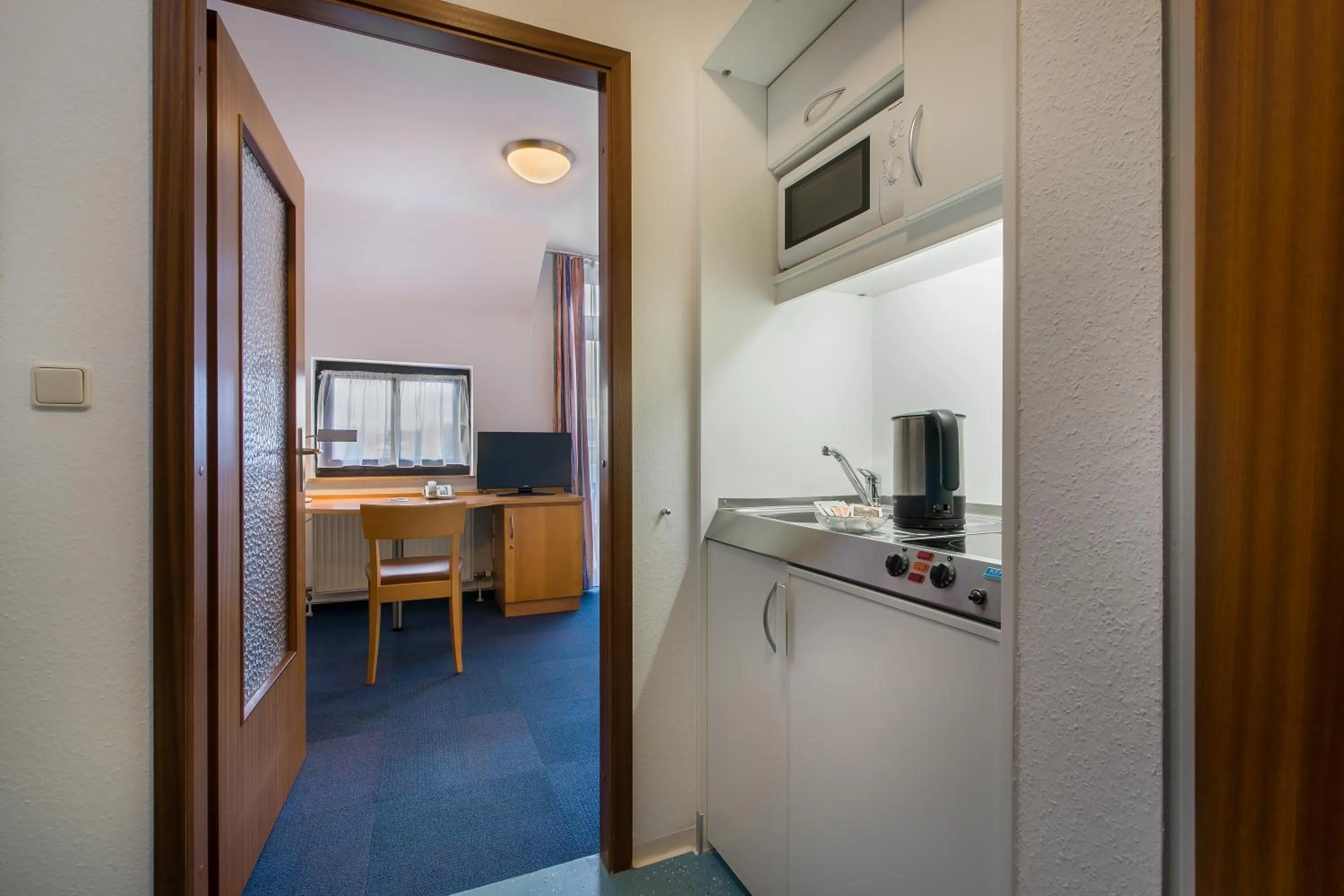 Kitchen or kitchenette in acora Karlsruhe Zentrum Living the City