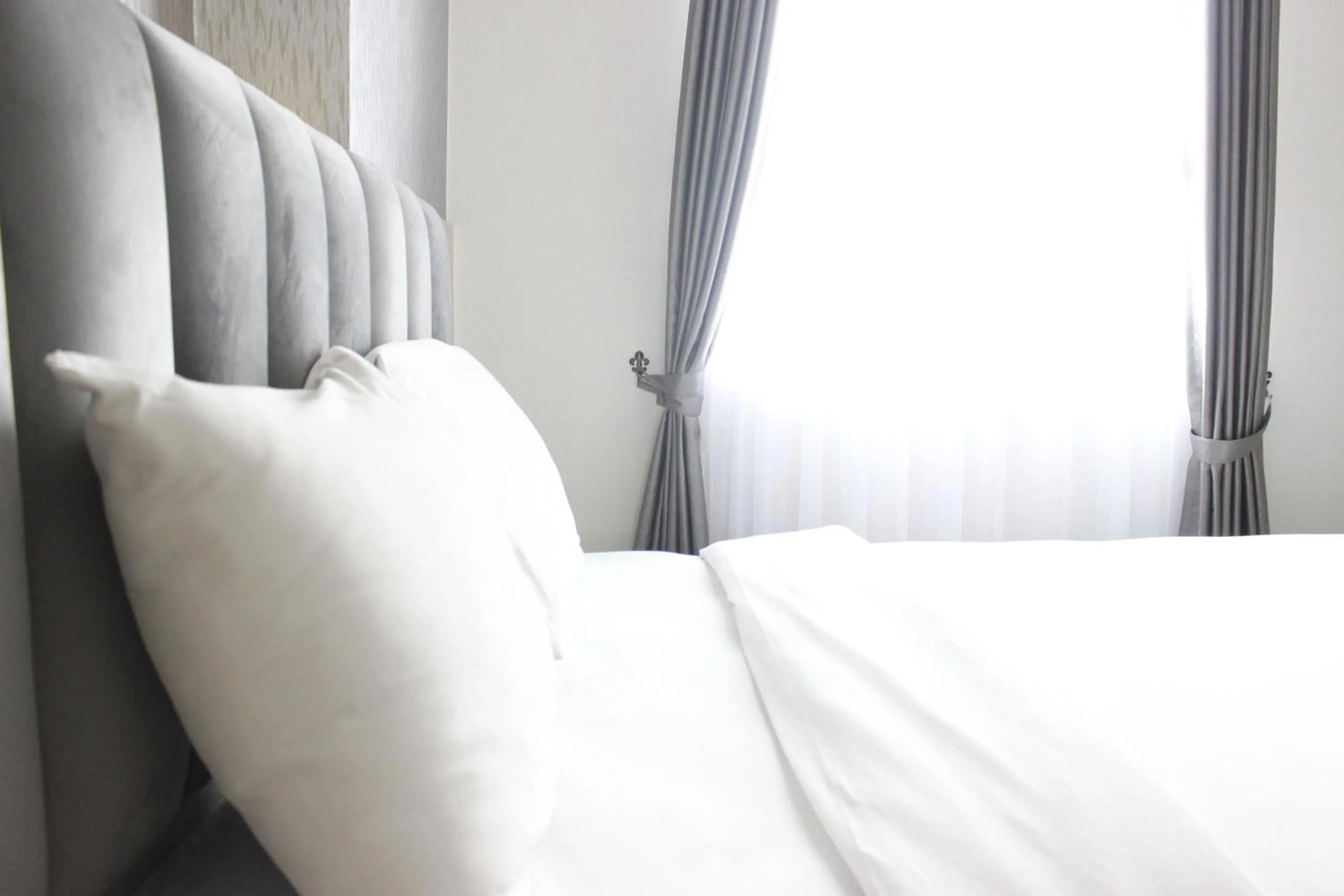 Bright and Stylish 2BR at Gateway Pasteur Apartment By Travelio