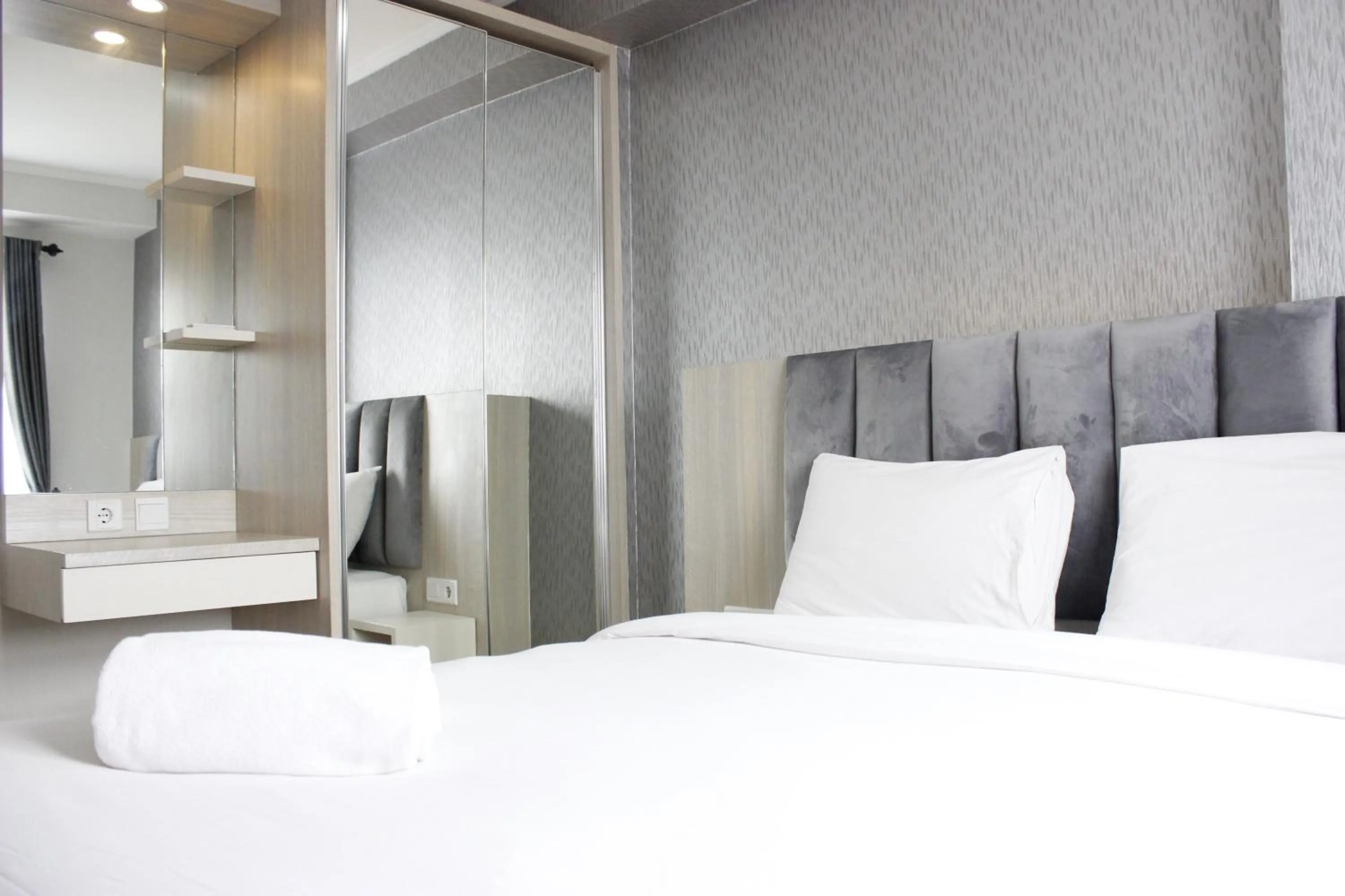 Bright and Stylish 2BR at Gateway Pasteur Apartment By Travelio