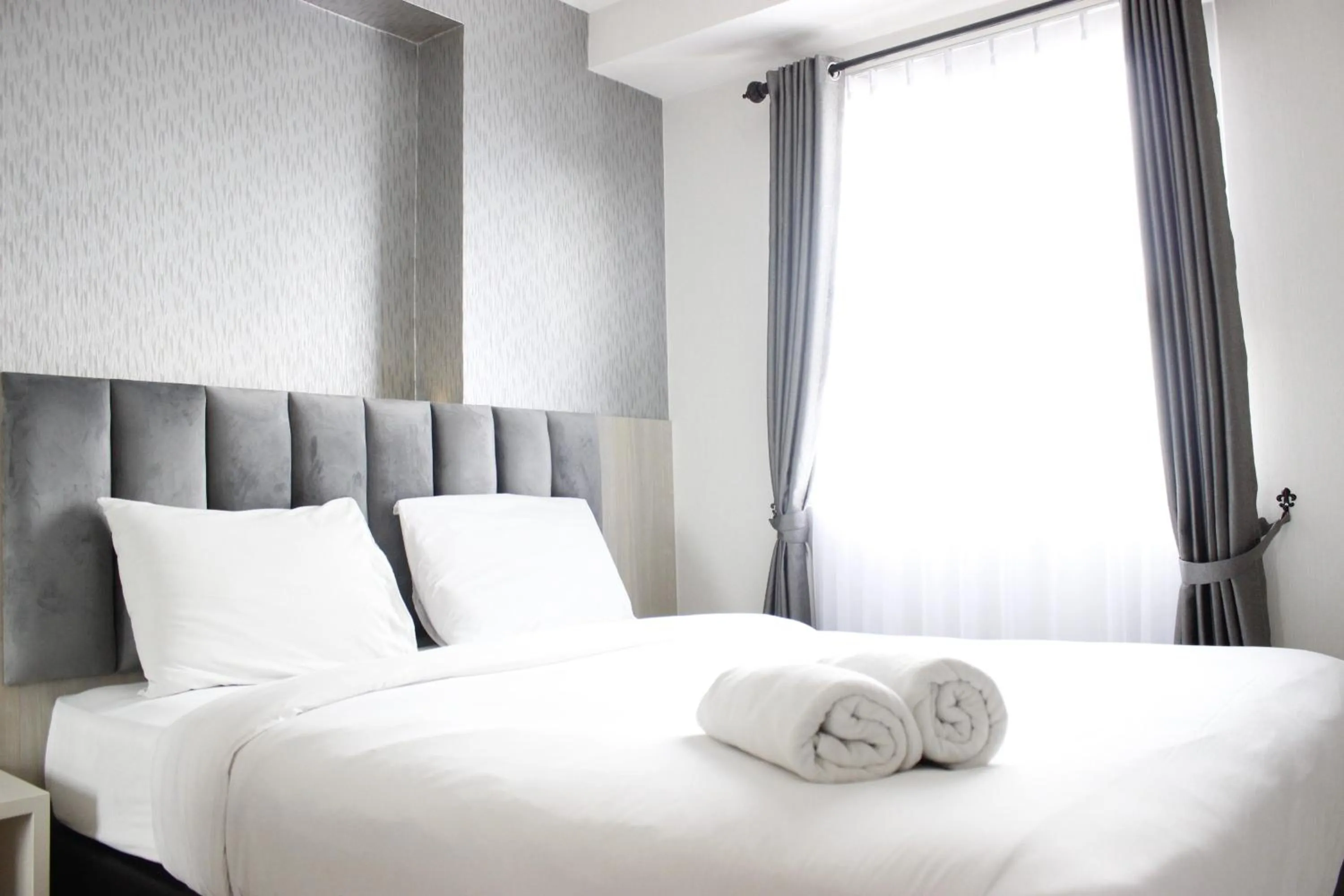 Bright and Stylish 2BR at Gateway Pasteur Apartment By Travelio