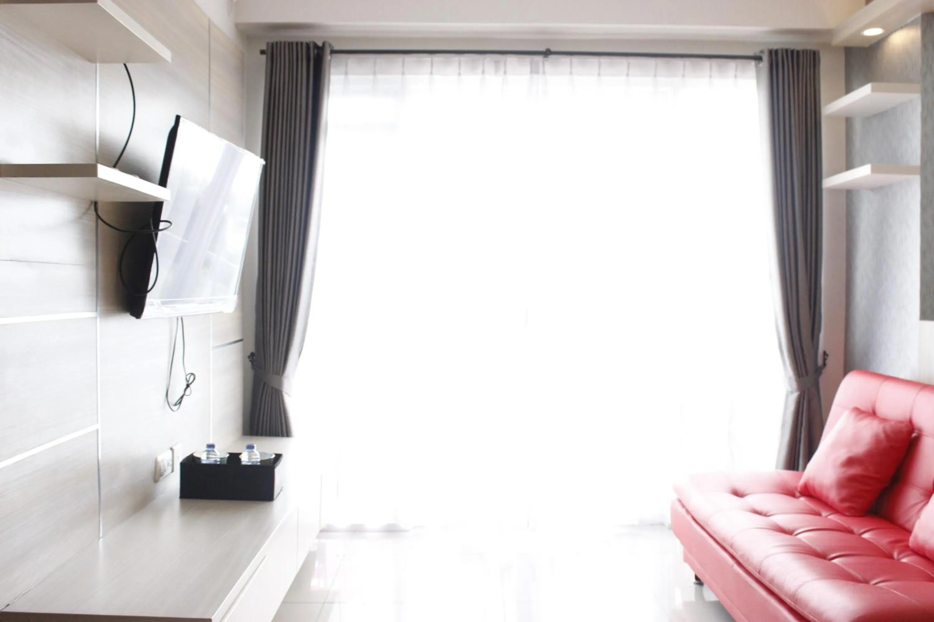 Bright and Stylish 2BR at Gateway Pasteur Apartment By Travelio