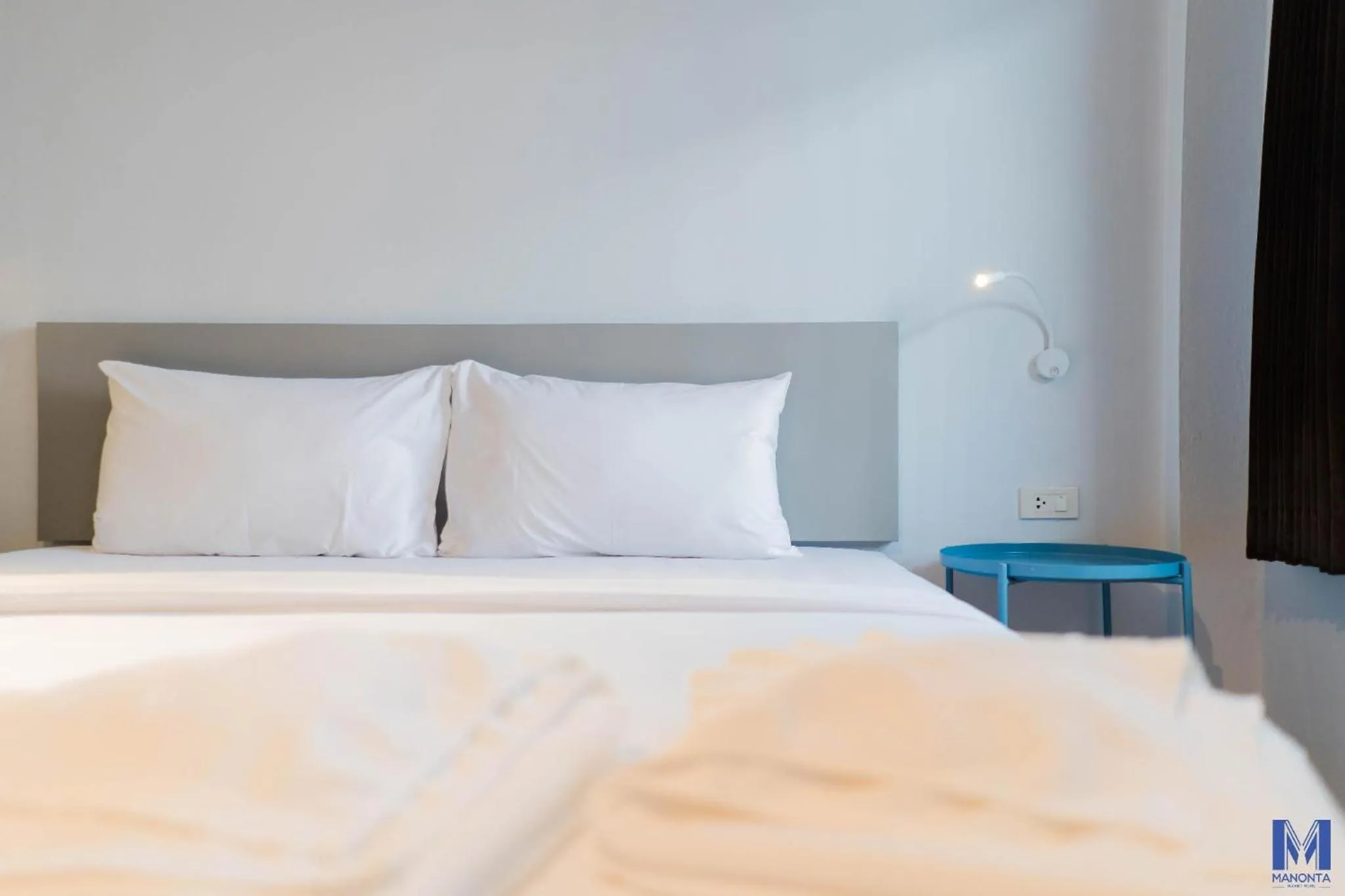 Bed in Manonta Budget Hotel