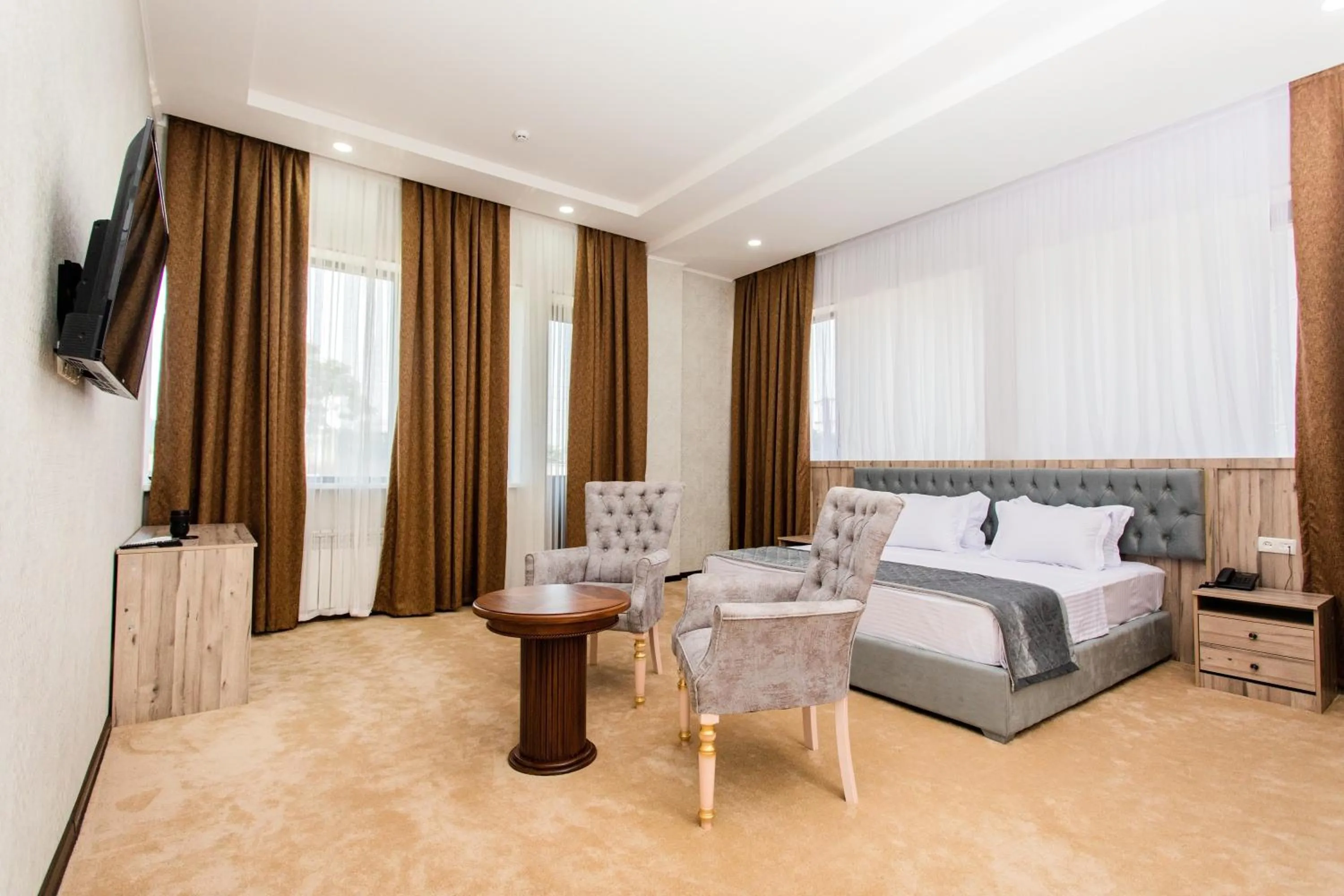 Communal lounge/ TV room in Gabrielle International Hotel