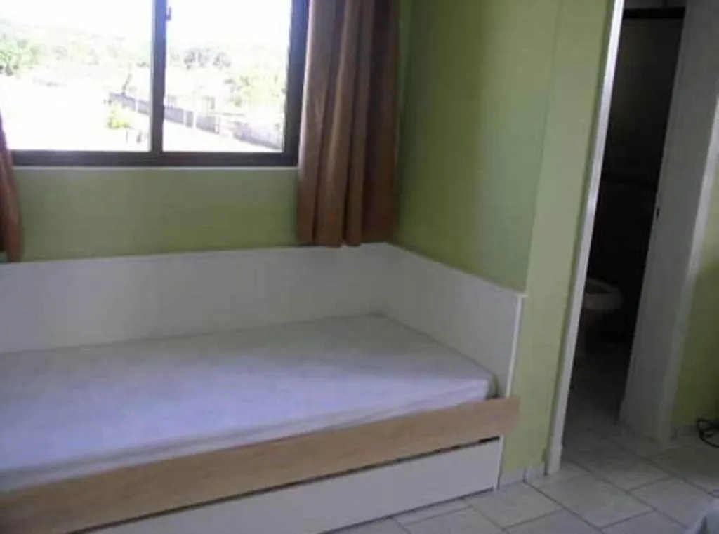 Bed in Hotel Pousada Mineirinho