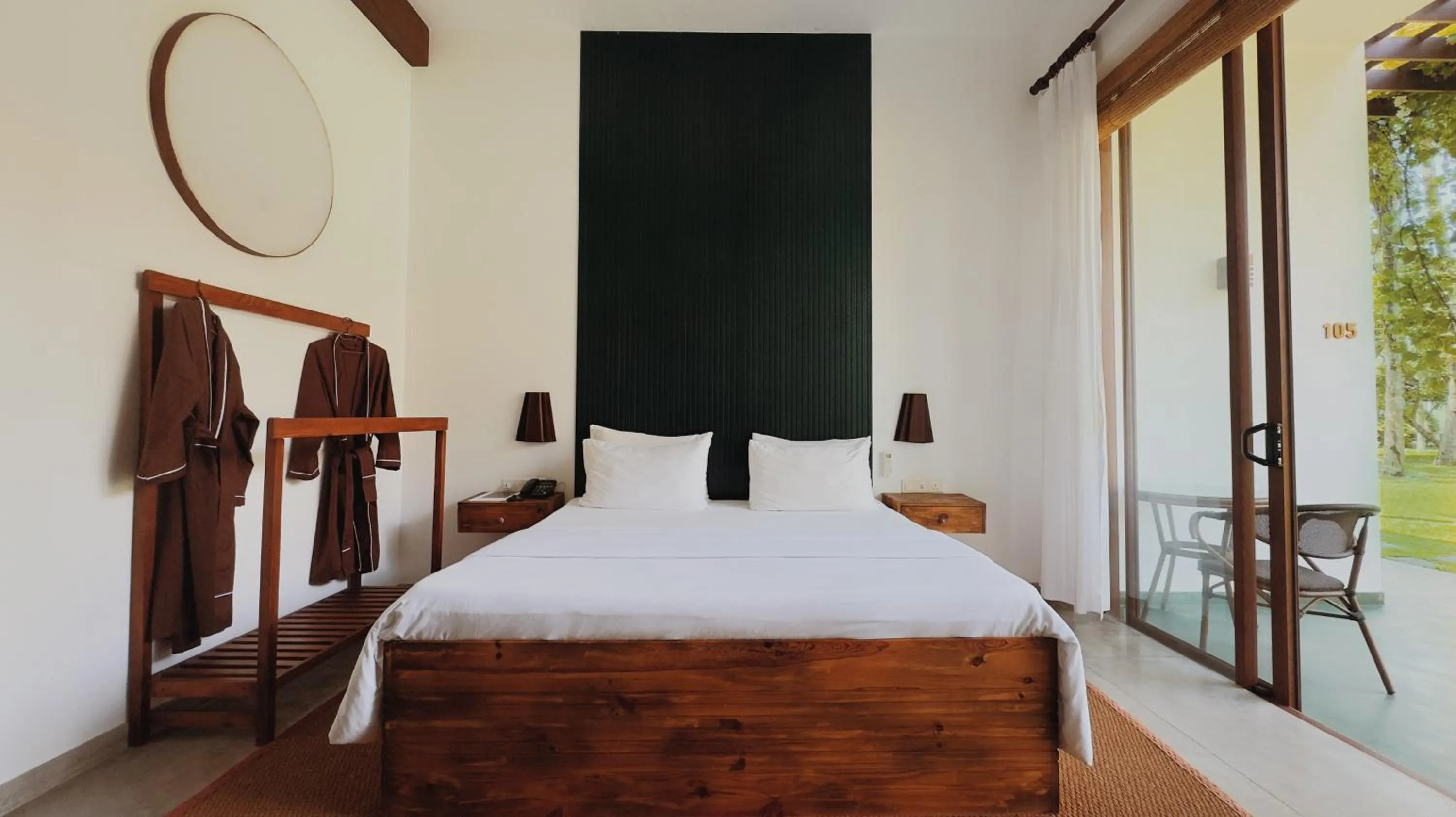 Bed in Palm Garden Ayurveda Resort