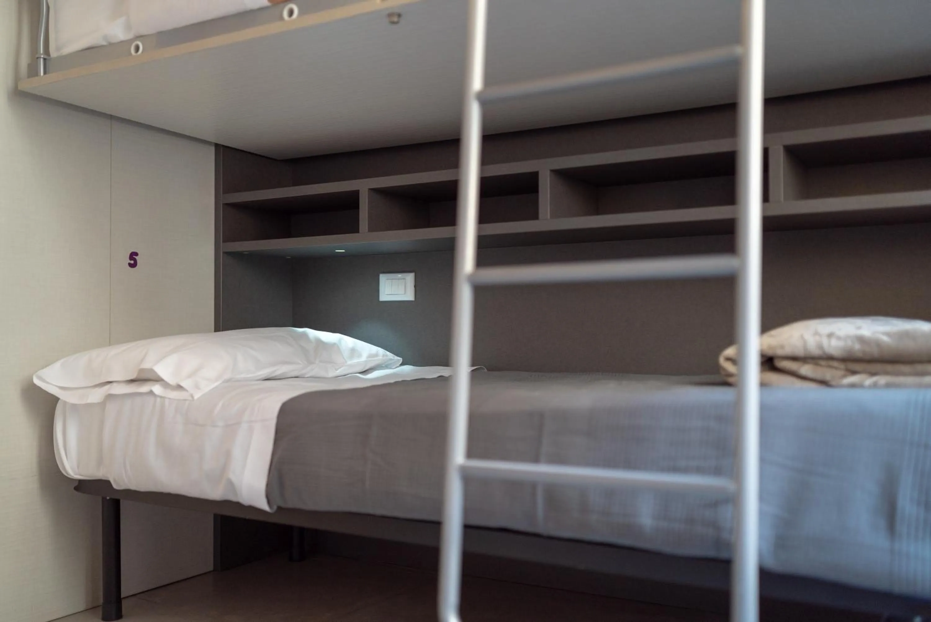 bunk bed in LUOGO COMUNE Ostello