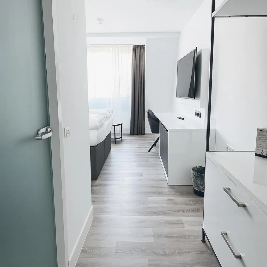 Photo of the whole room, Bed in DORMERO Hotel Dessau-Roßlau