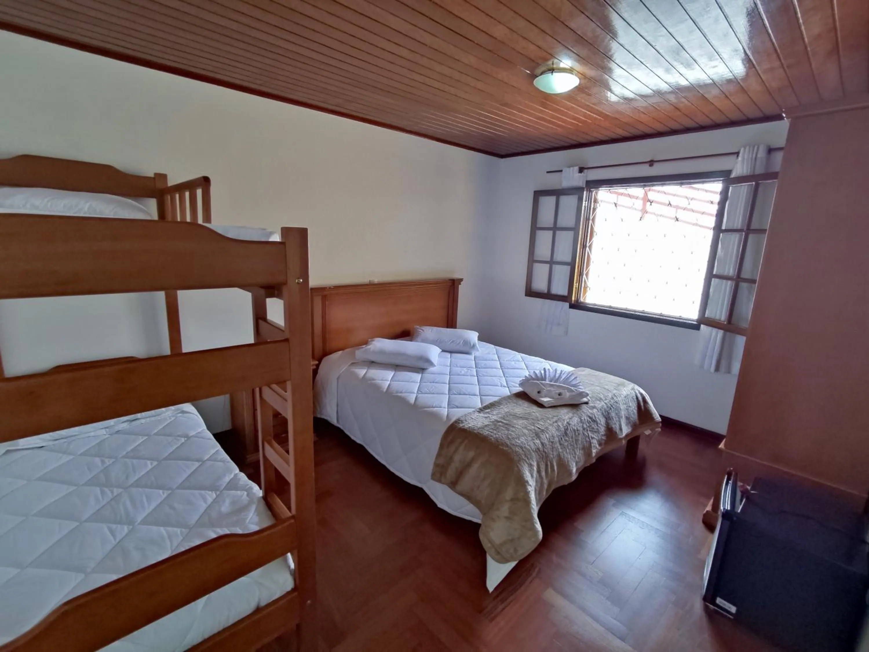 Bed in Pousada Portal da Serra