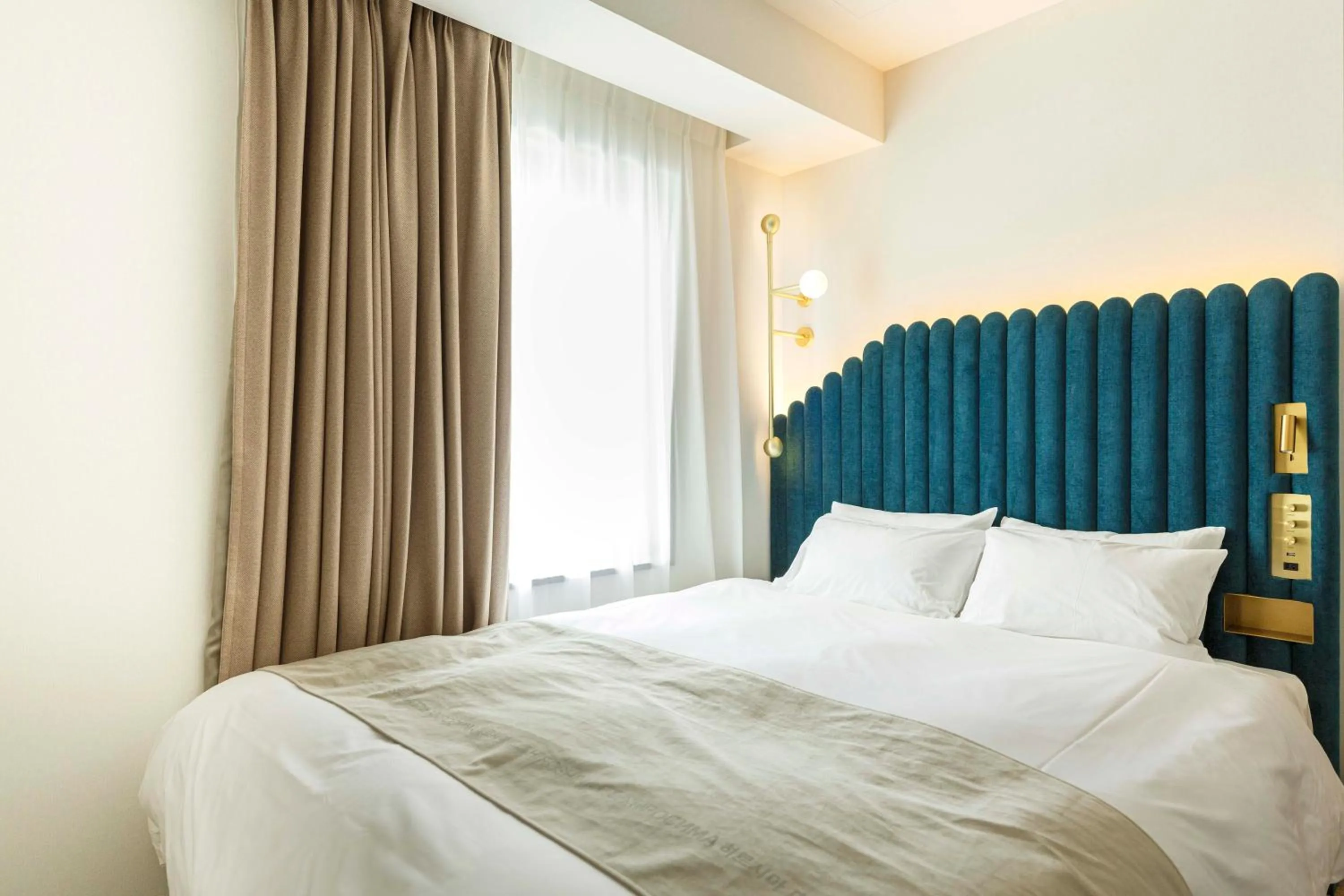 Photo of the whole room, Bed in The Knot Hiroshima