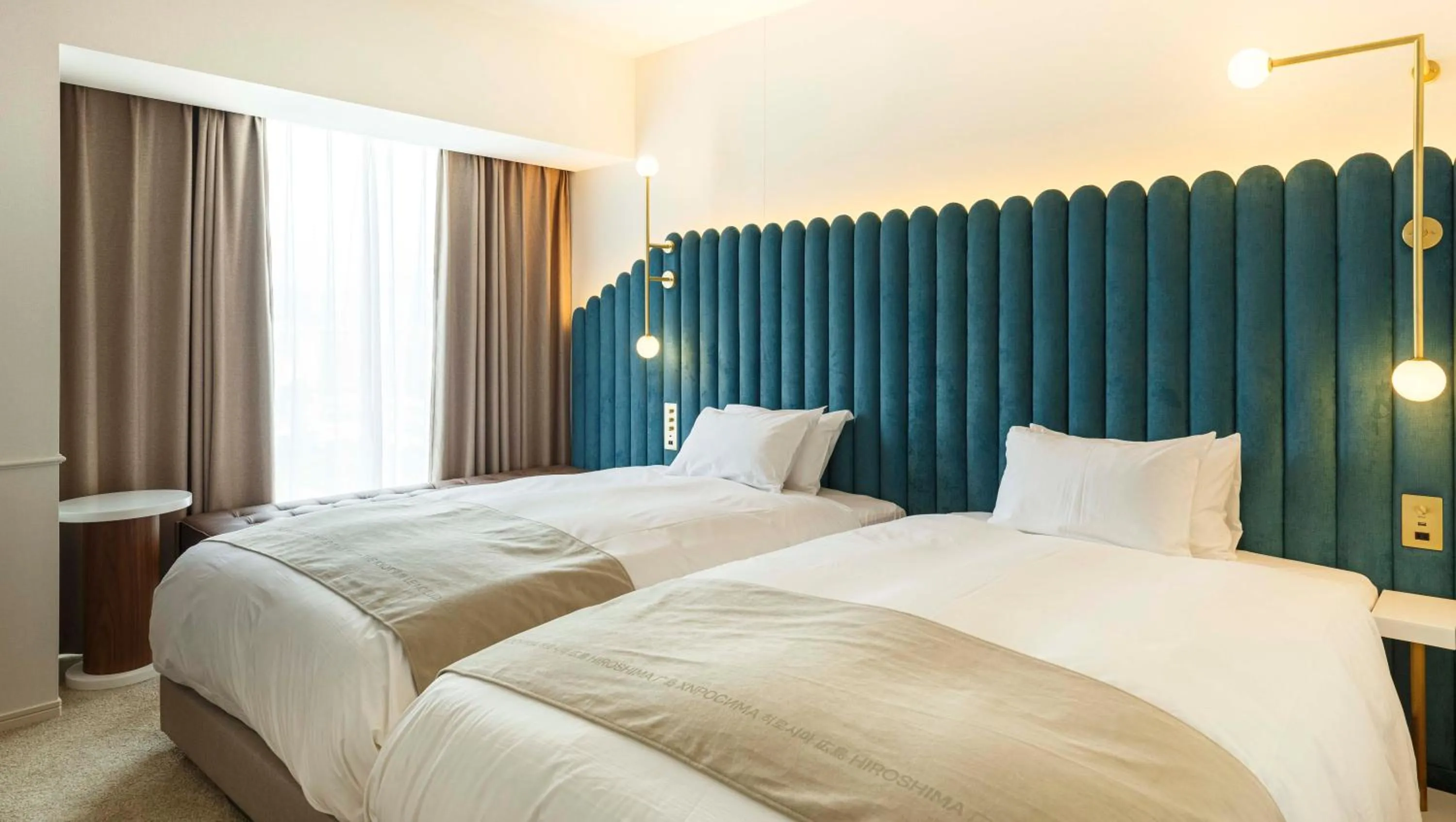 Photo of the whole room, Bed in The Knot Hiroshima