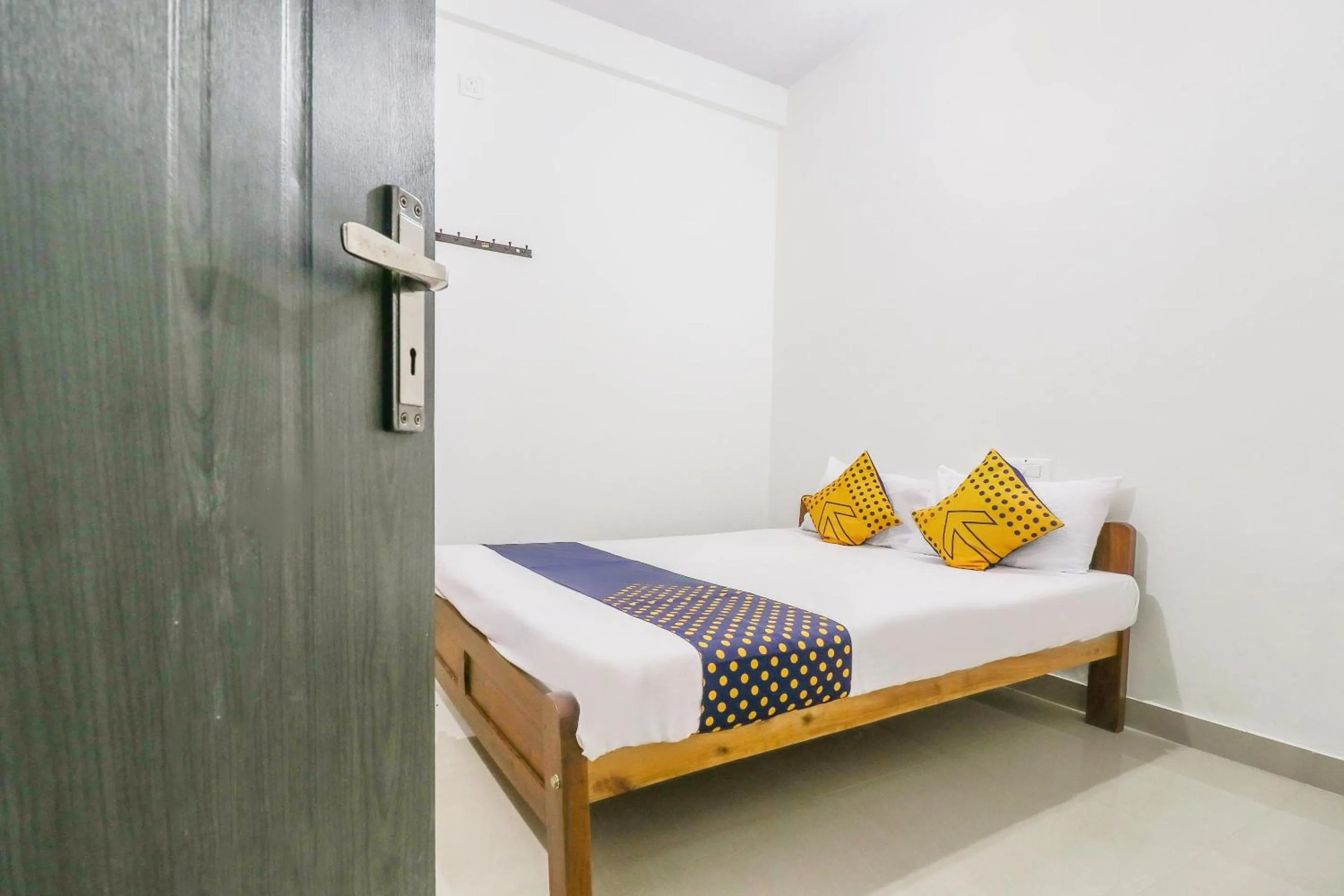 Bedroom, Bed in SPOT ON Rohini Inn Kadampuzha
