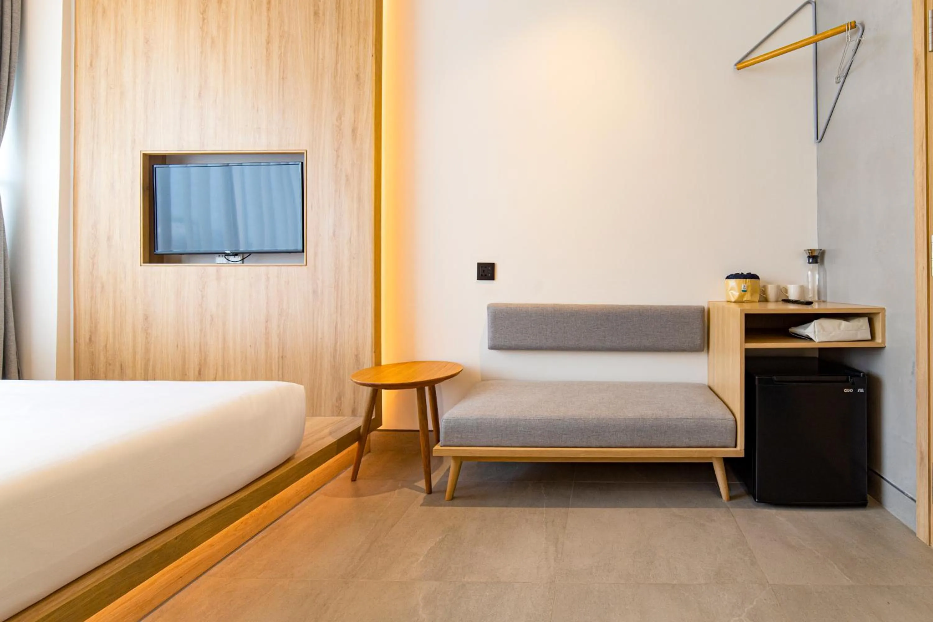 Seating area, Bed in MEANDER Saigon