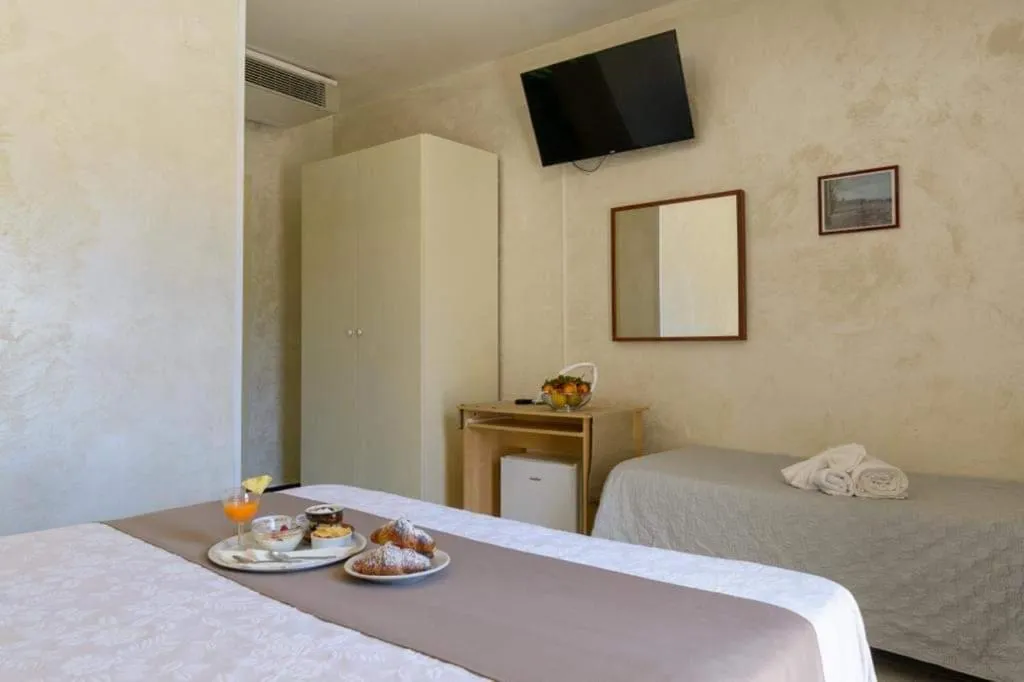 Bed in HOTEL CRISTALLO PAESTUM