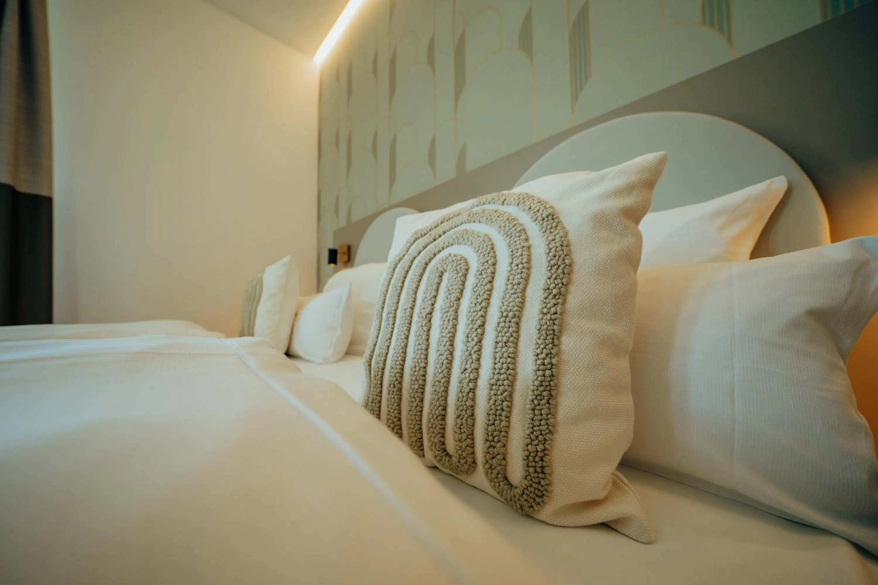 Bed in guestified BARBAROSSA Hotel