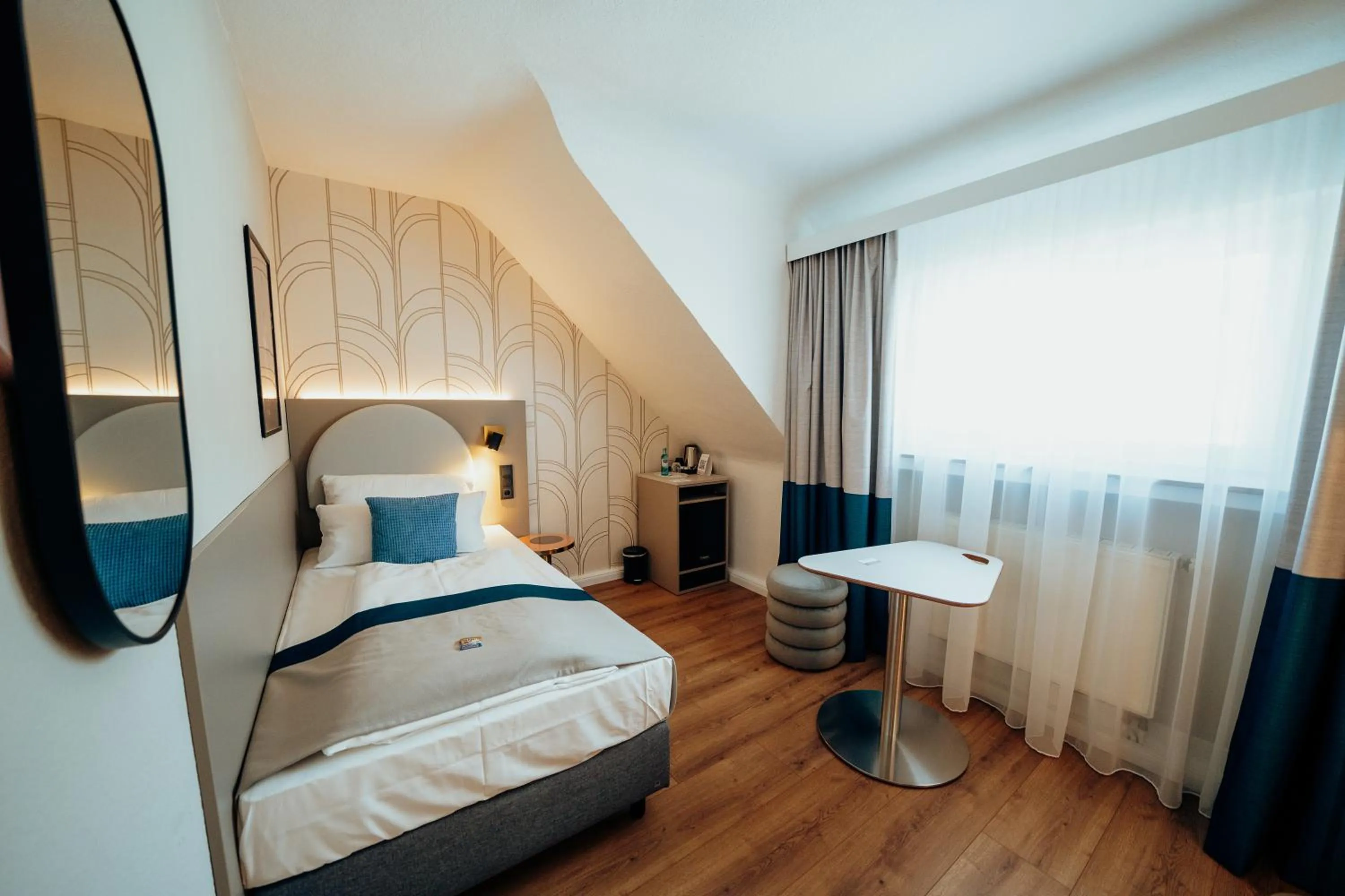 Bed in guestified BARBAROSSA Hotel