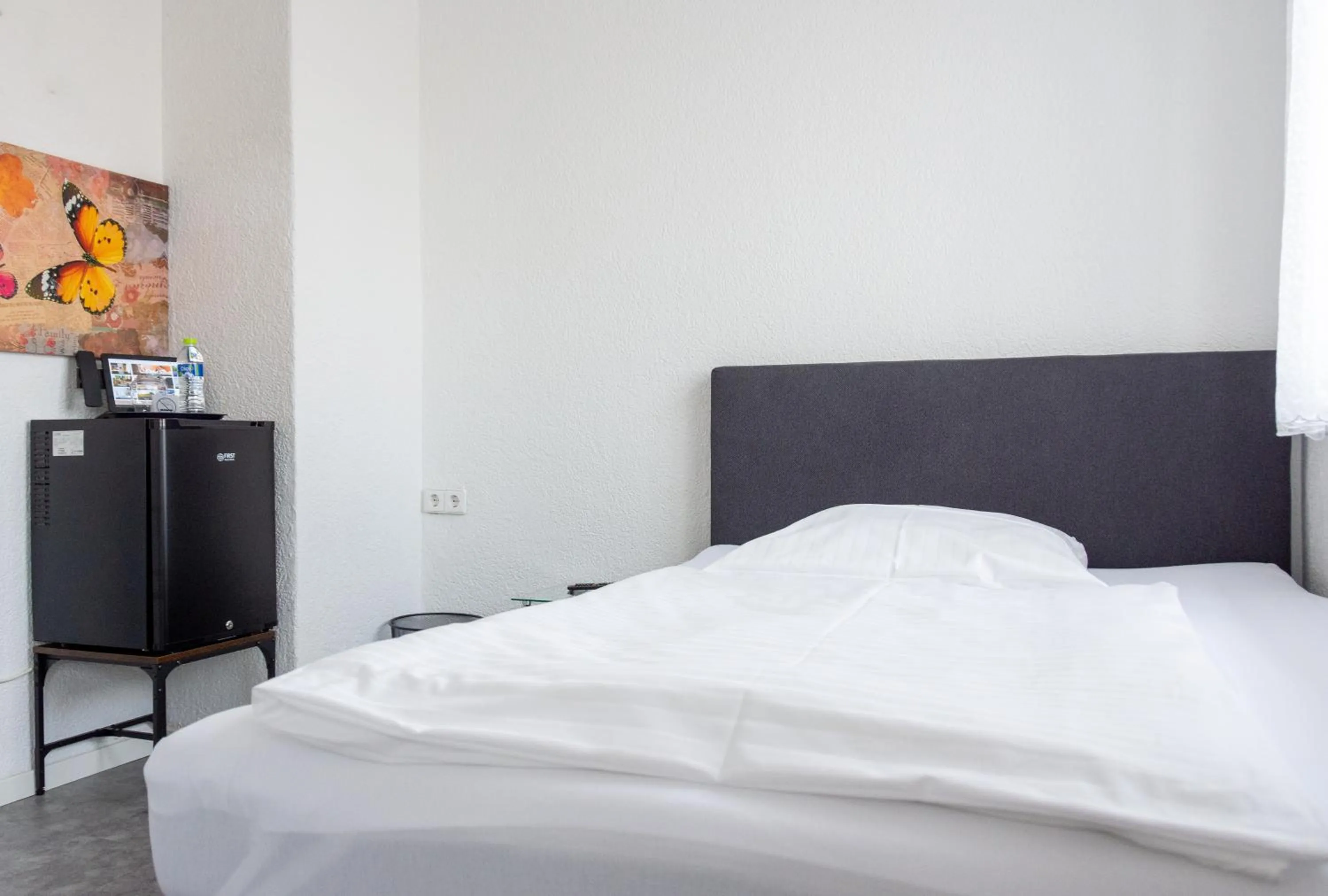 Bed in Hotel-Cocco-Bello in der Villa Foret