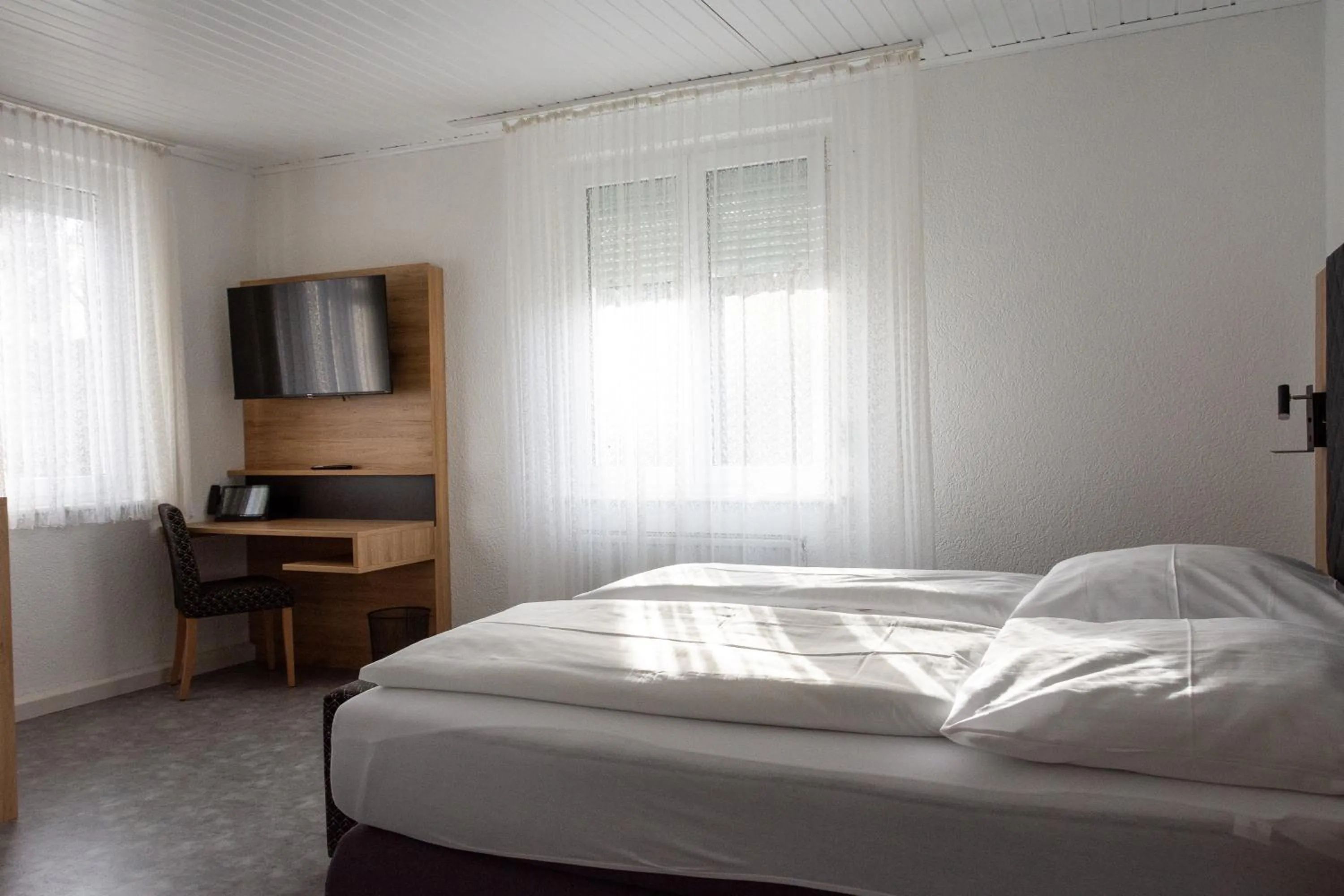 Bed in Hotel-Cocco-Bello in der Villa Foret