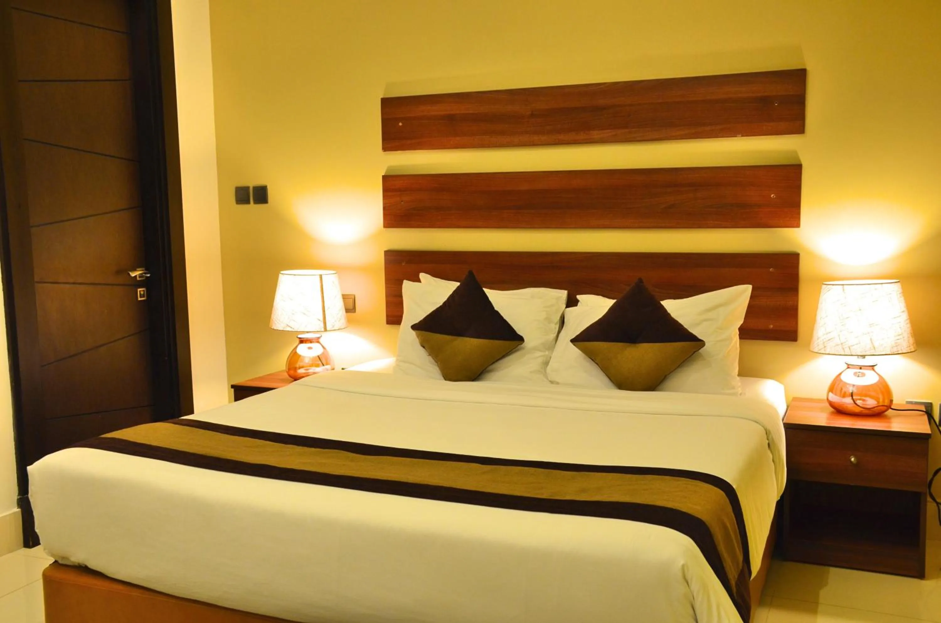 Photo of the whole room, Bed in Blaire Executive Suites