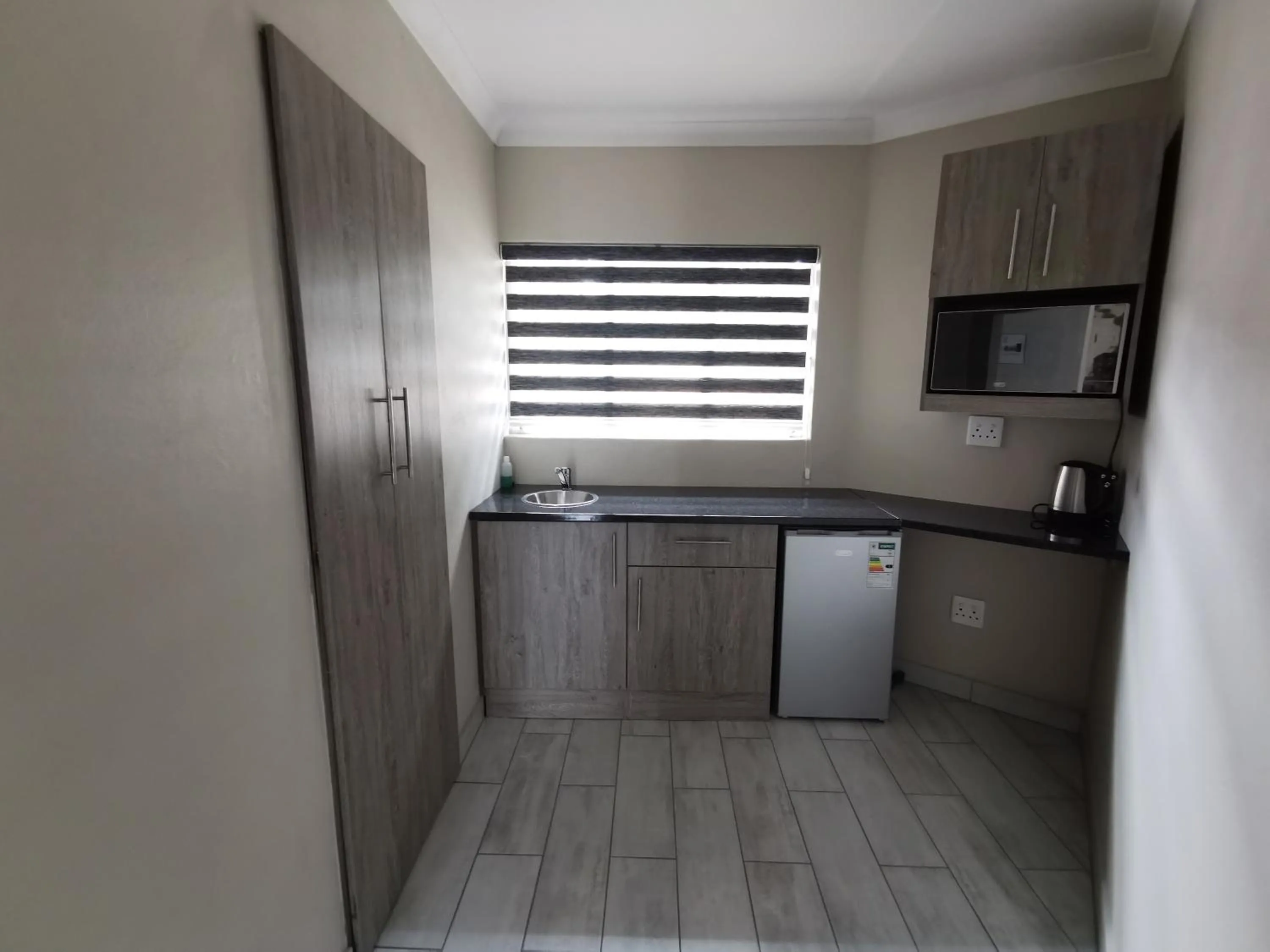 Kitchen or kitchenette in Up21 Guest House