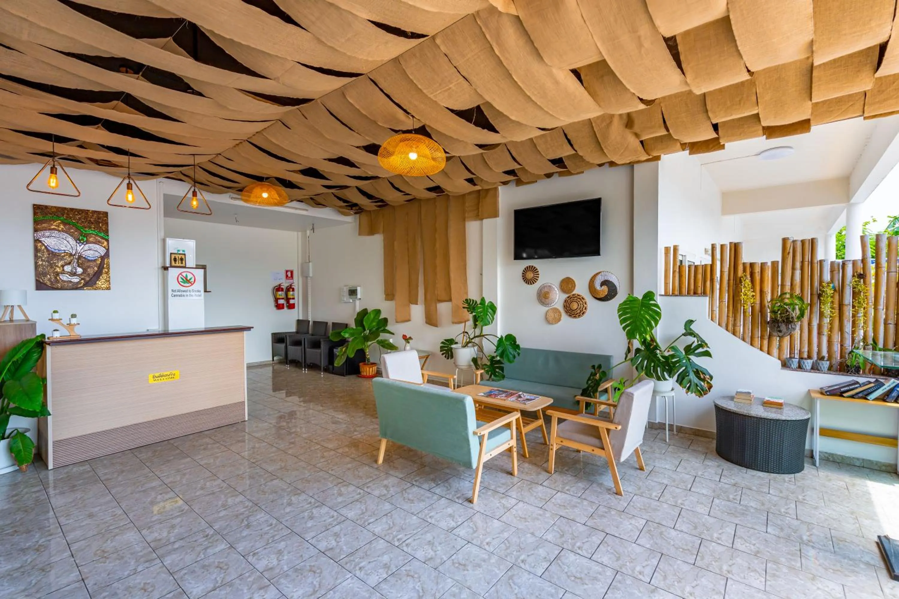 Communal lounge/ TV room in Kata Hill Sea View Hotel