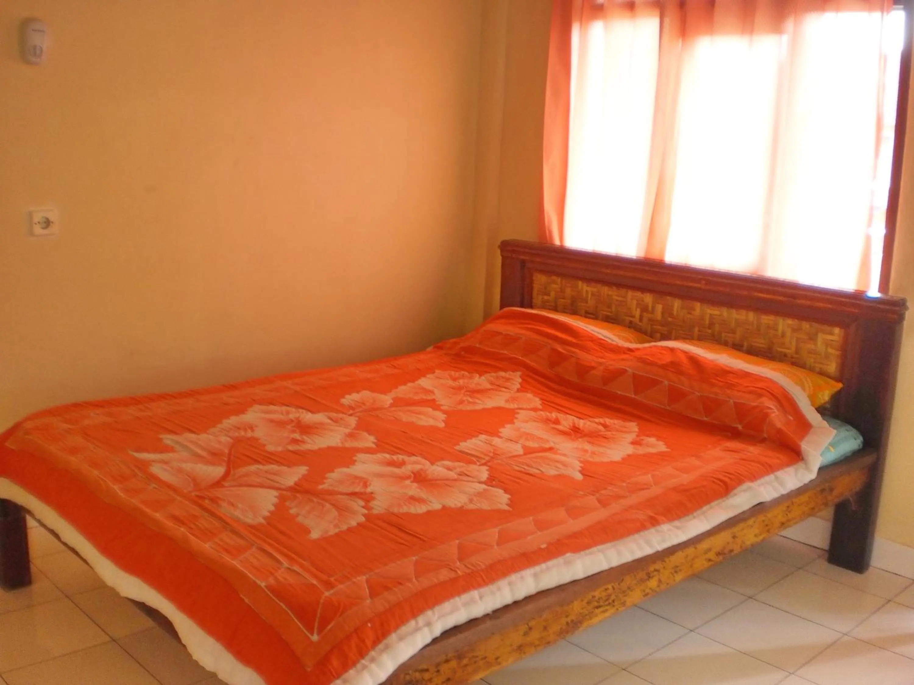Bed in Arjuna Homestay Ubud