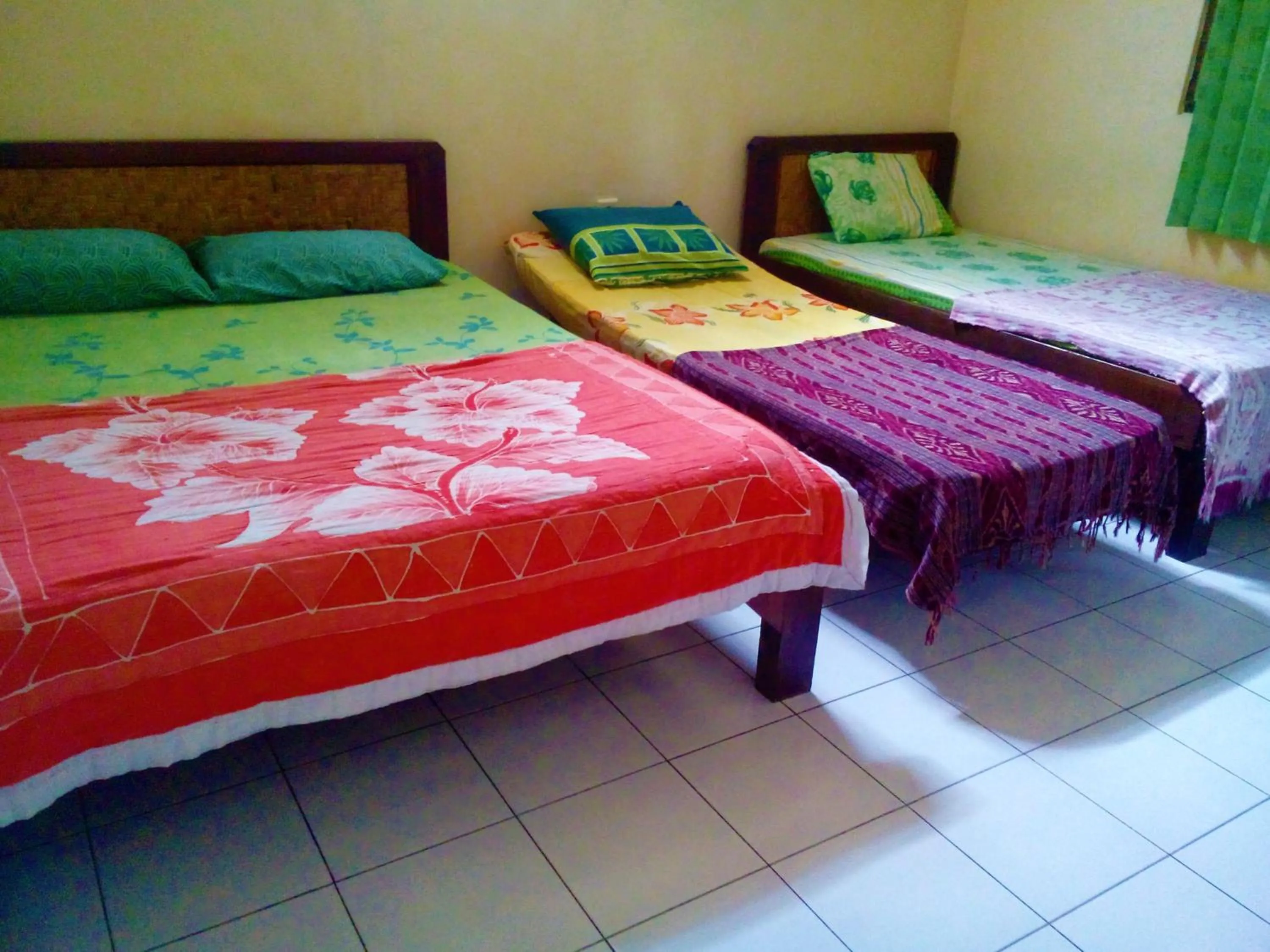 Bed in Arjuna Homestay Ubud