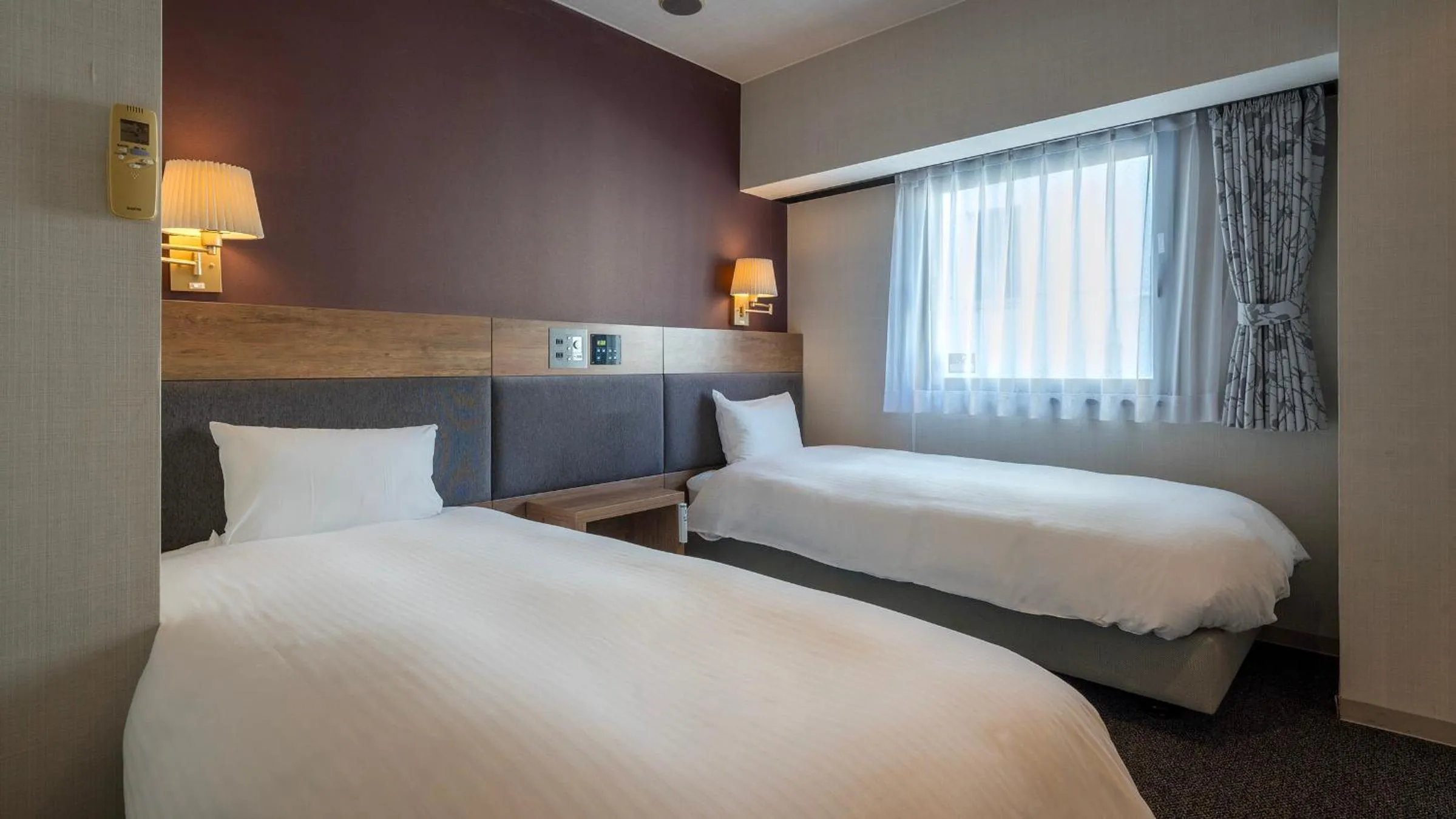 Bed in Hotel The Grand Court Tsunishi