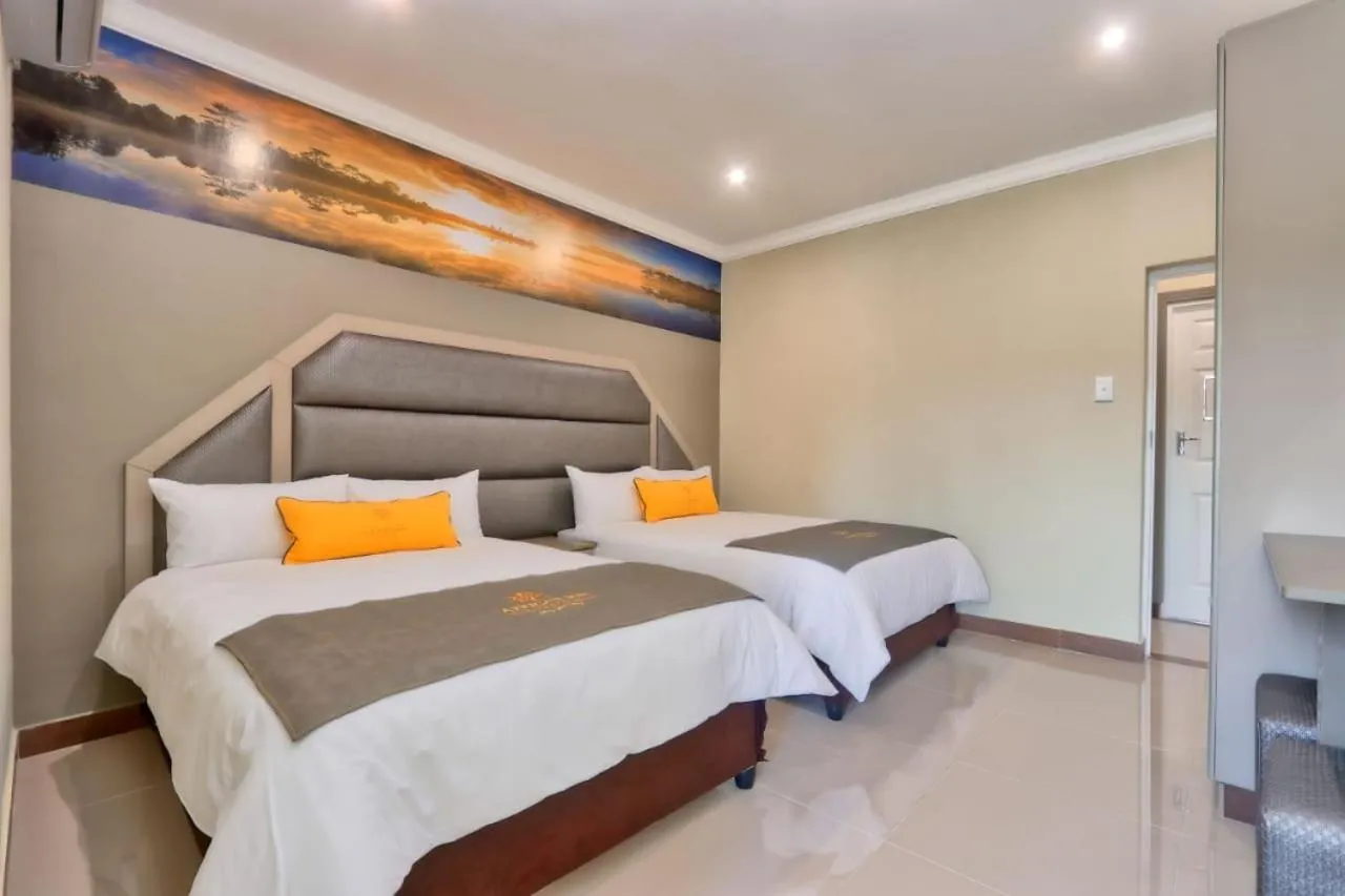 Bed in African Sun Lodge