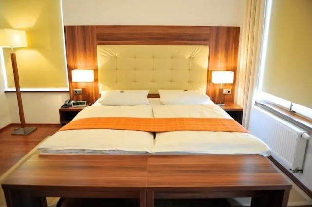 Photo of the whole room, Bed in Akzent Hotel Tietmeyer & Cross Side