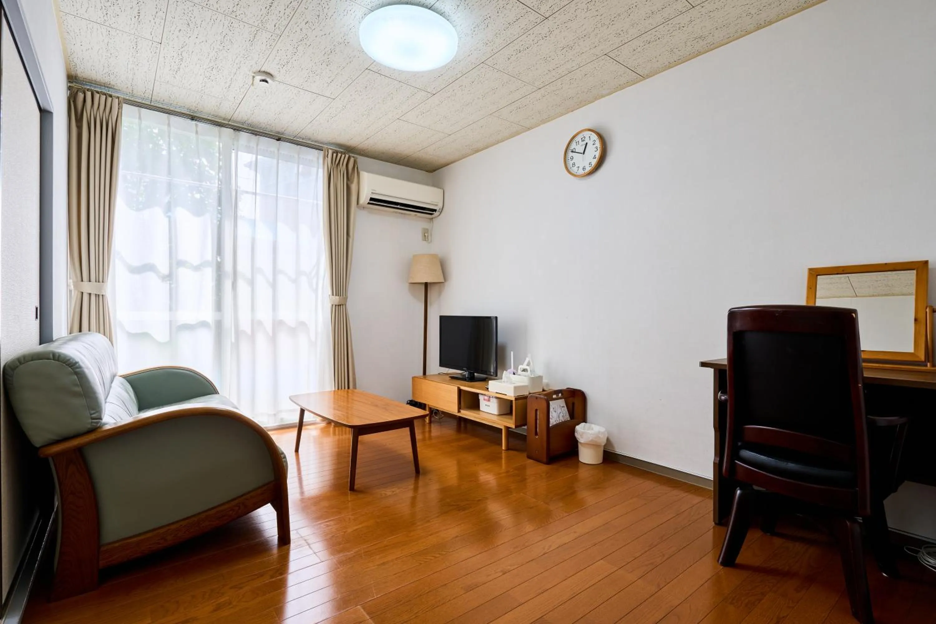 Living room in Enoshima Apartment Hotel