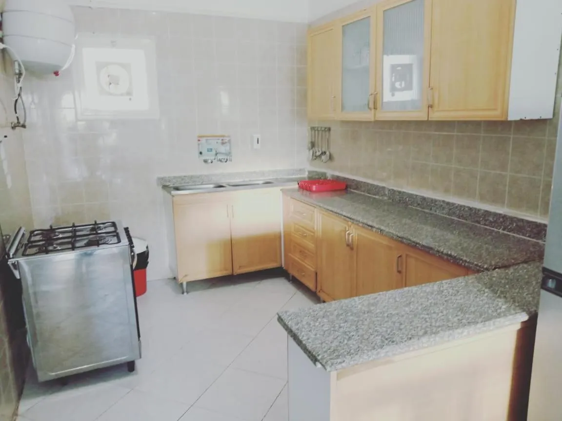 Kitchen or kitchenette in Green Leaves Hotel