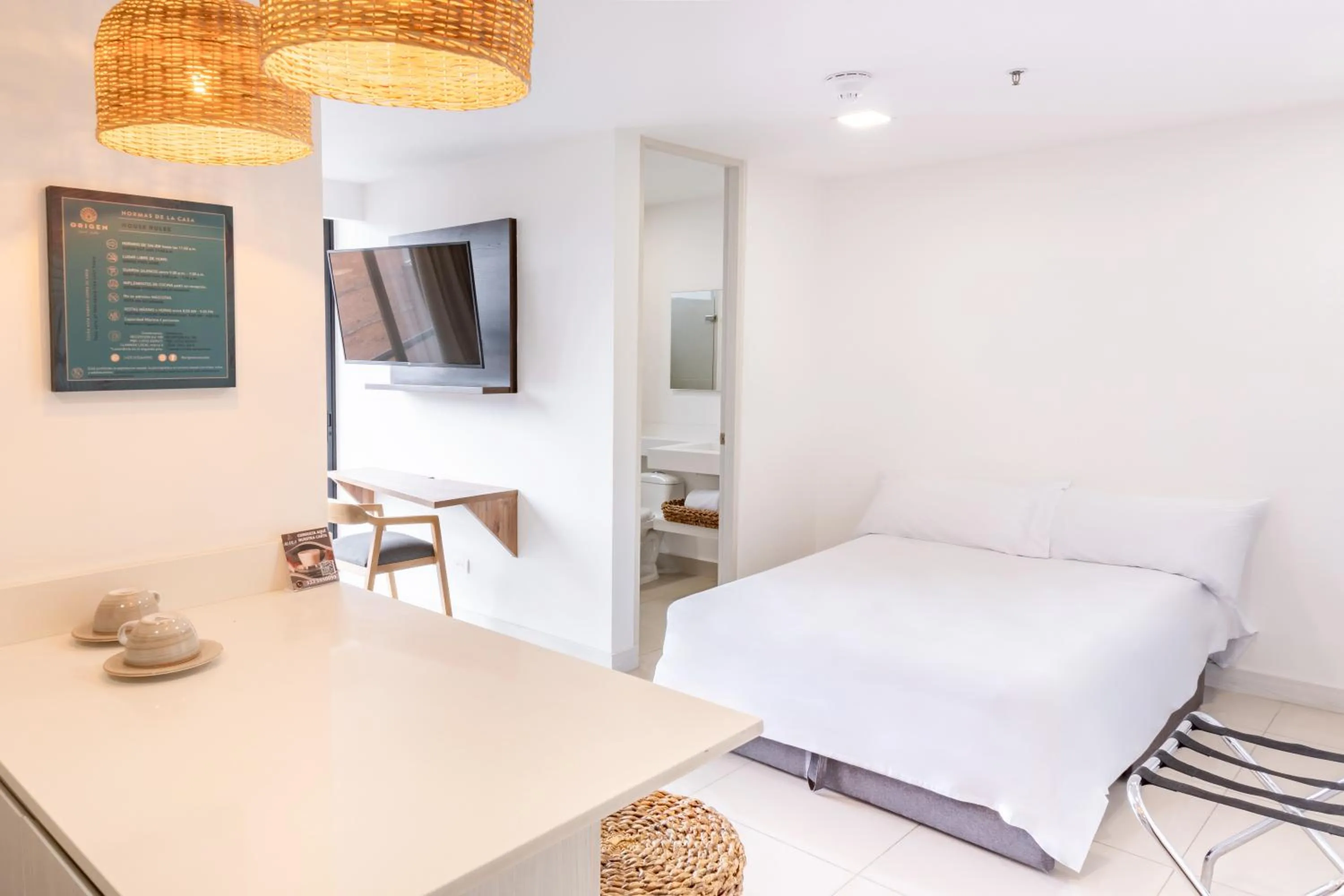 Bed in Origen Local Suites