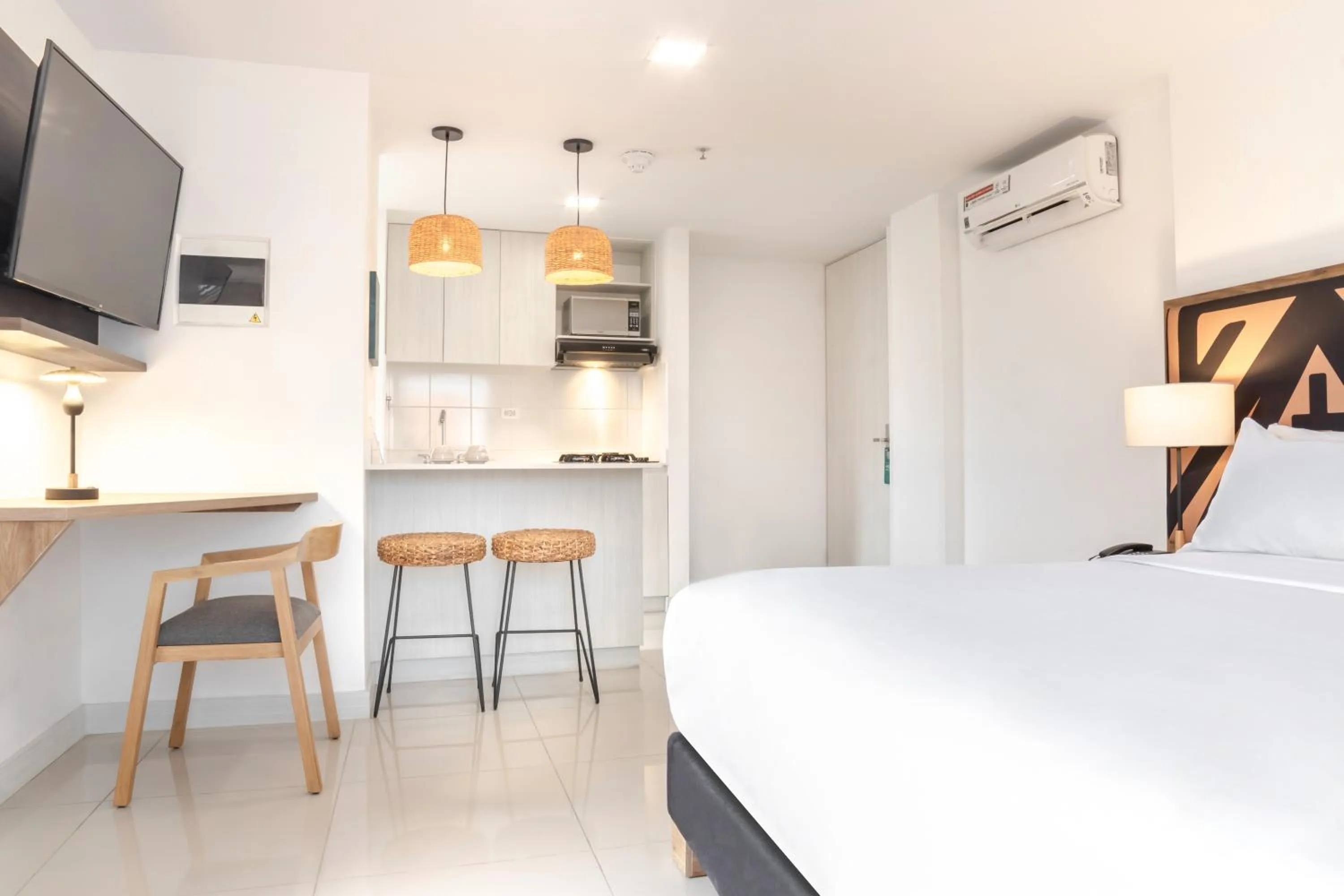 Bed in Origen Local Suites