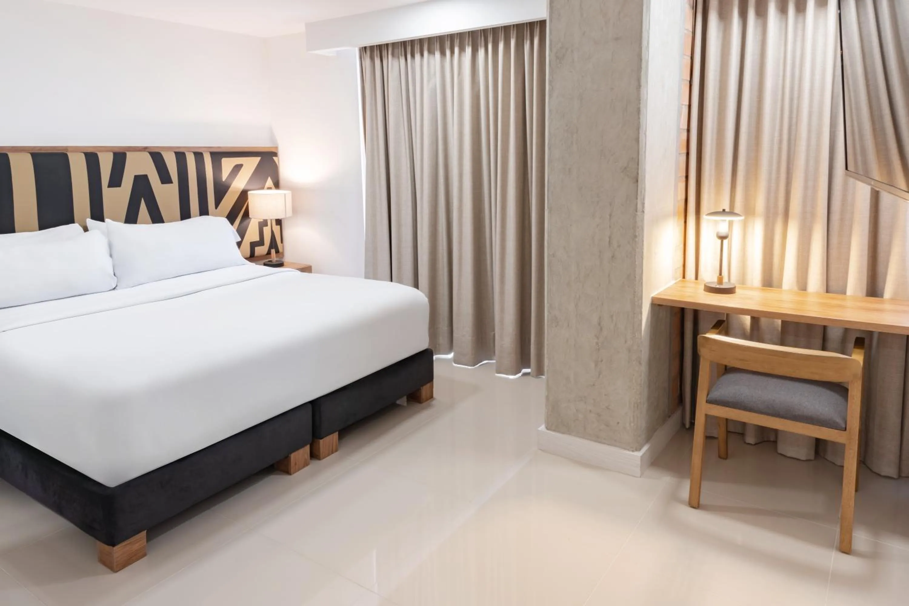 Bed in Origen Local Suites