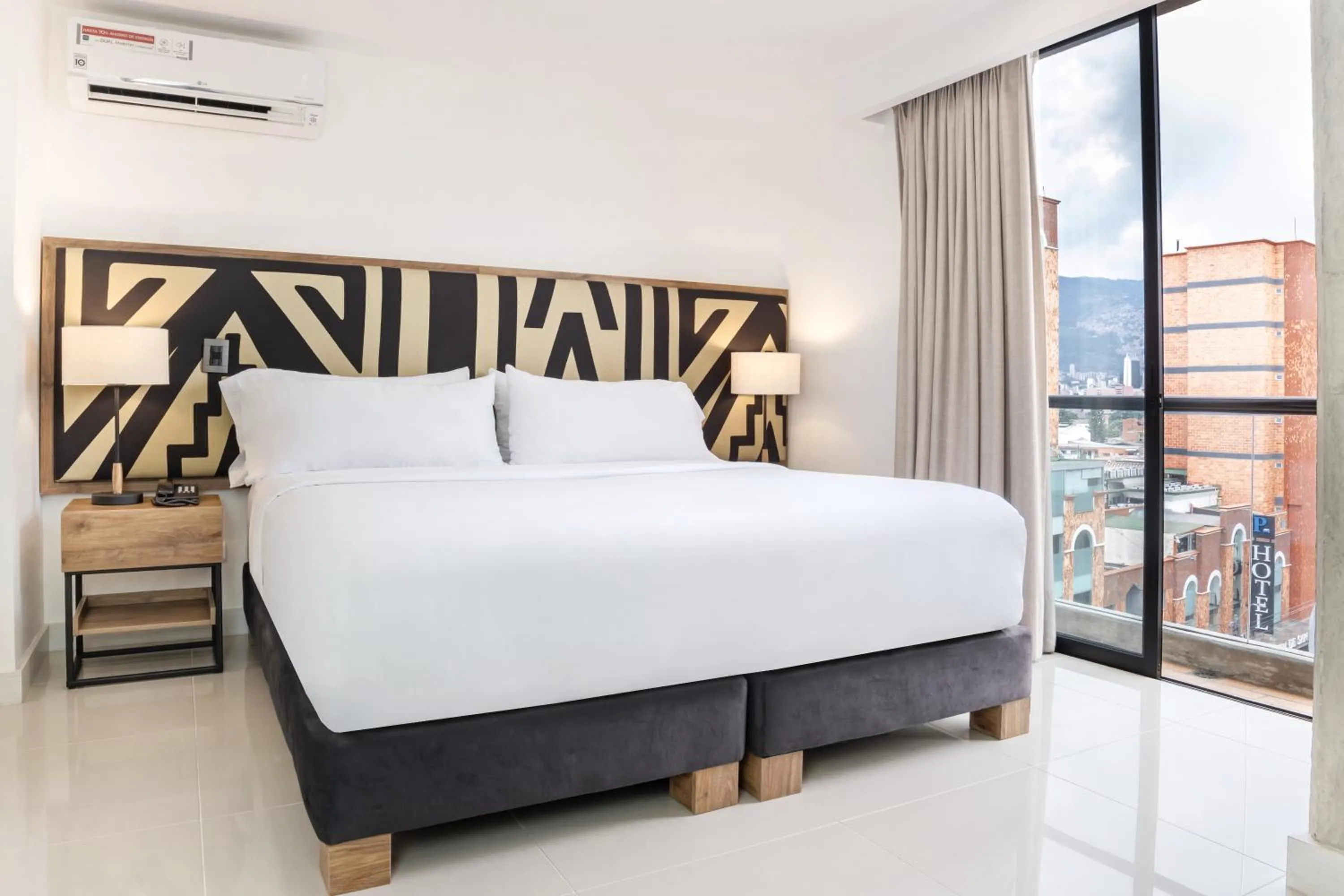 Bed in Origen Local Suites