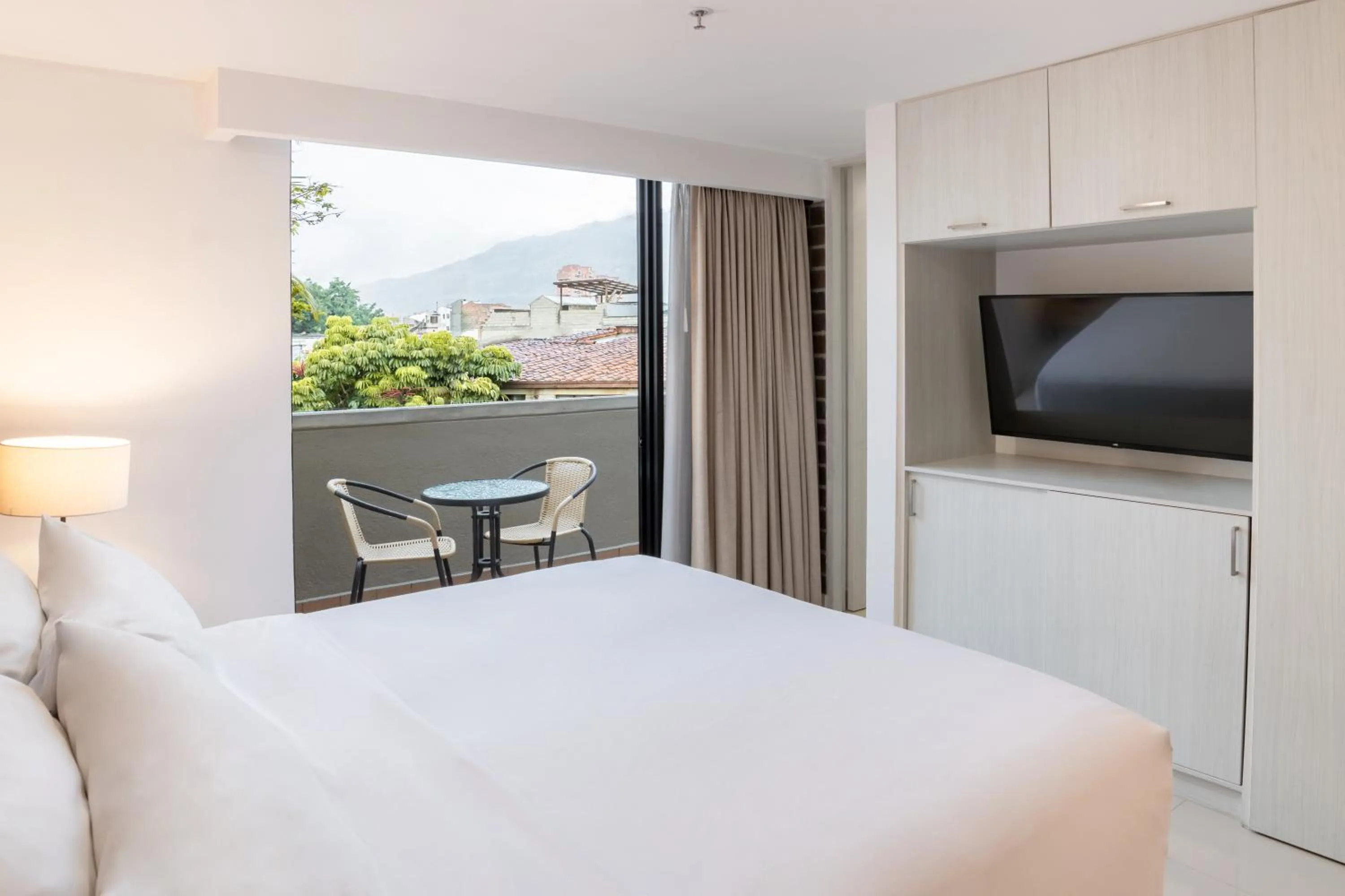 Bed in Origen Local Suites