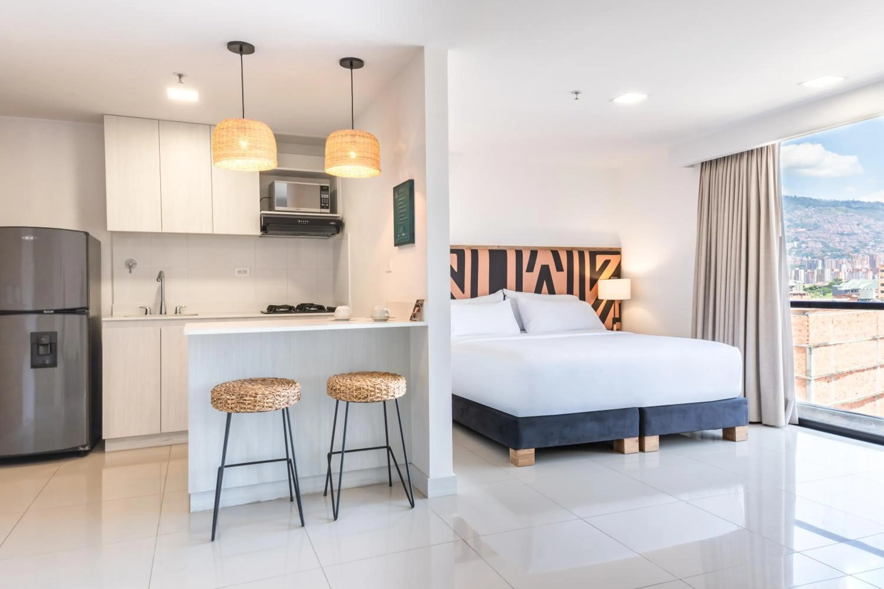 Bed in Origen Local Suites