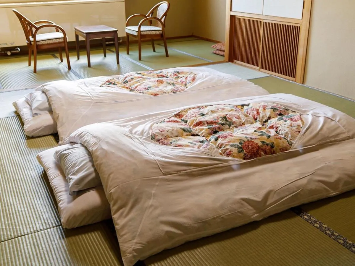 Bed in Hotel Iwasuge