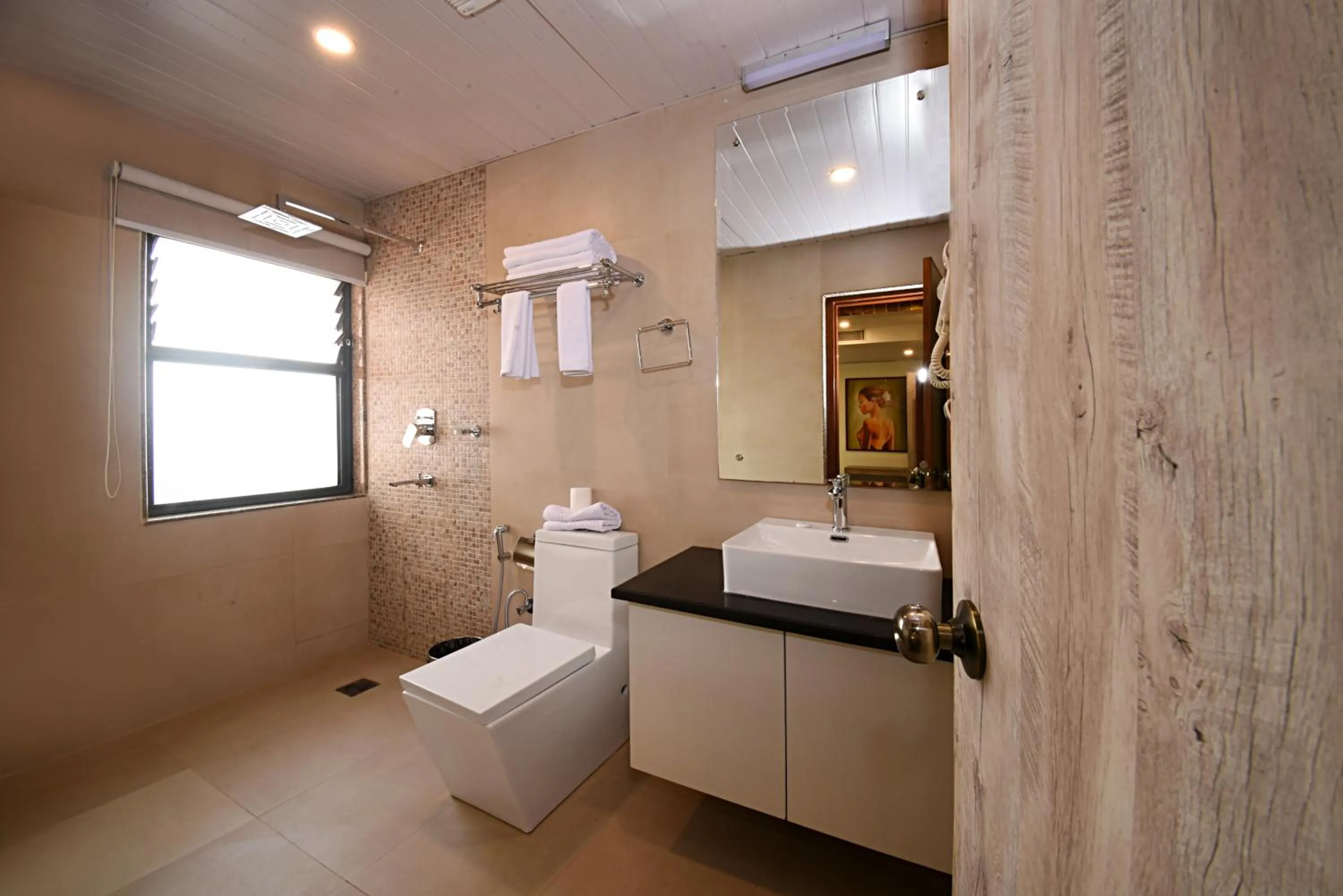 Shower in Woodapple Hotel and Spa