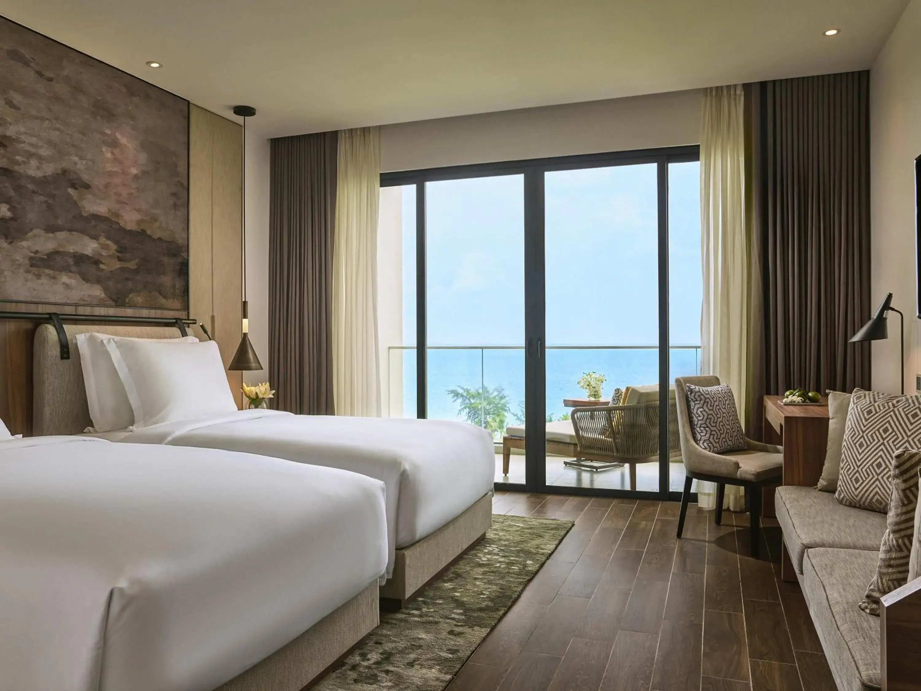 Superior Twin Room with Balcony and Sea View in Mövenpick Resort Waverly Phu Quoc Superior Twin Room with Balcony and Sea View in Mövenpick Resort Waverly Phu Quoc