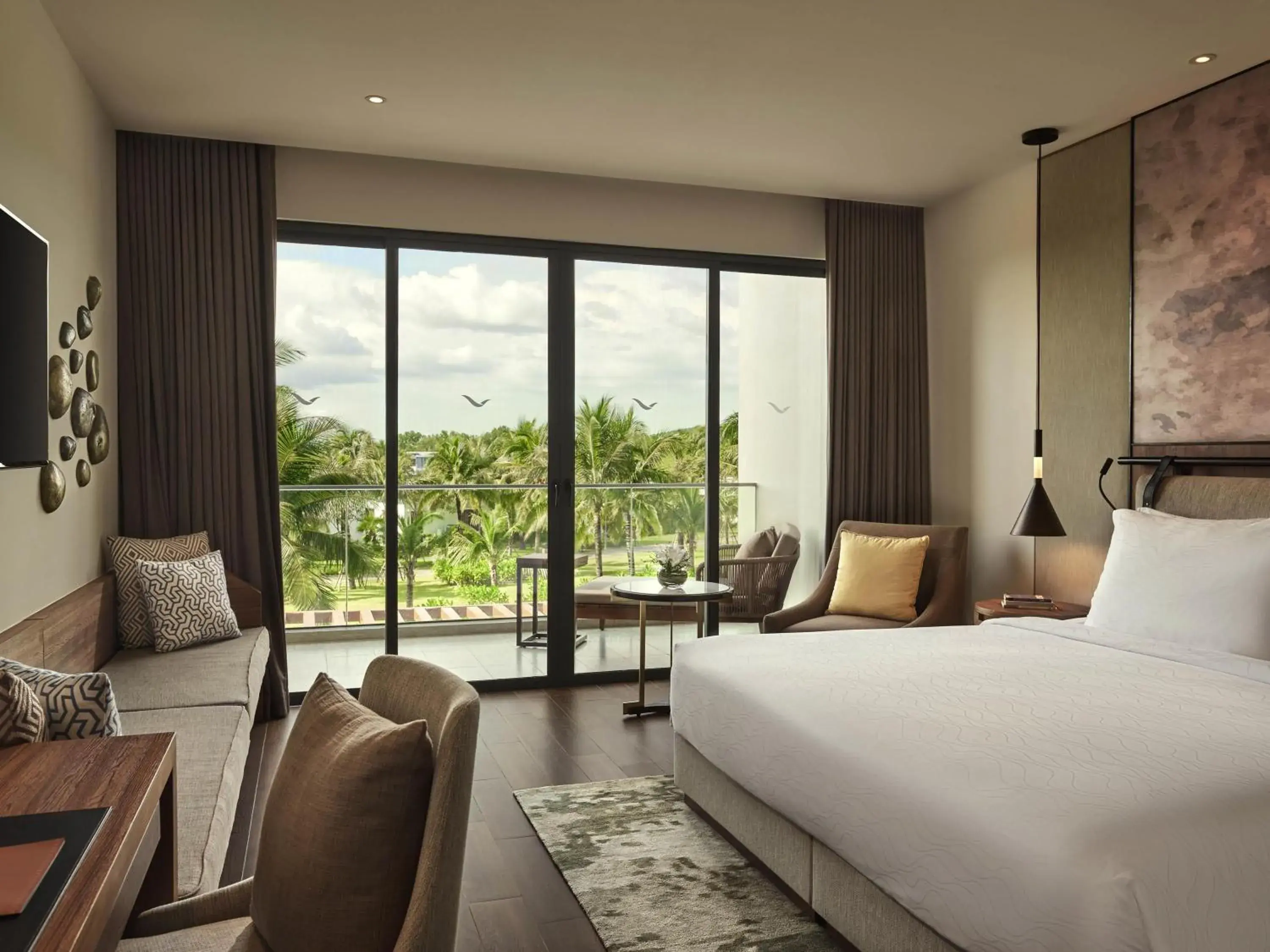 Superior King Room with Balcony and Garden View in Mövenpick Resort Waverly Phu Quoc Superior King Room with Balcony and Garden View in Mövenpick Resort Waverly Phu Quoc